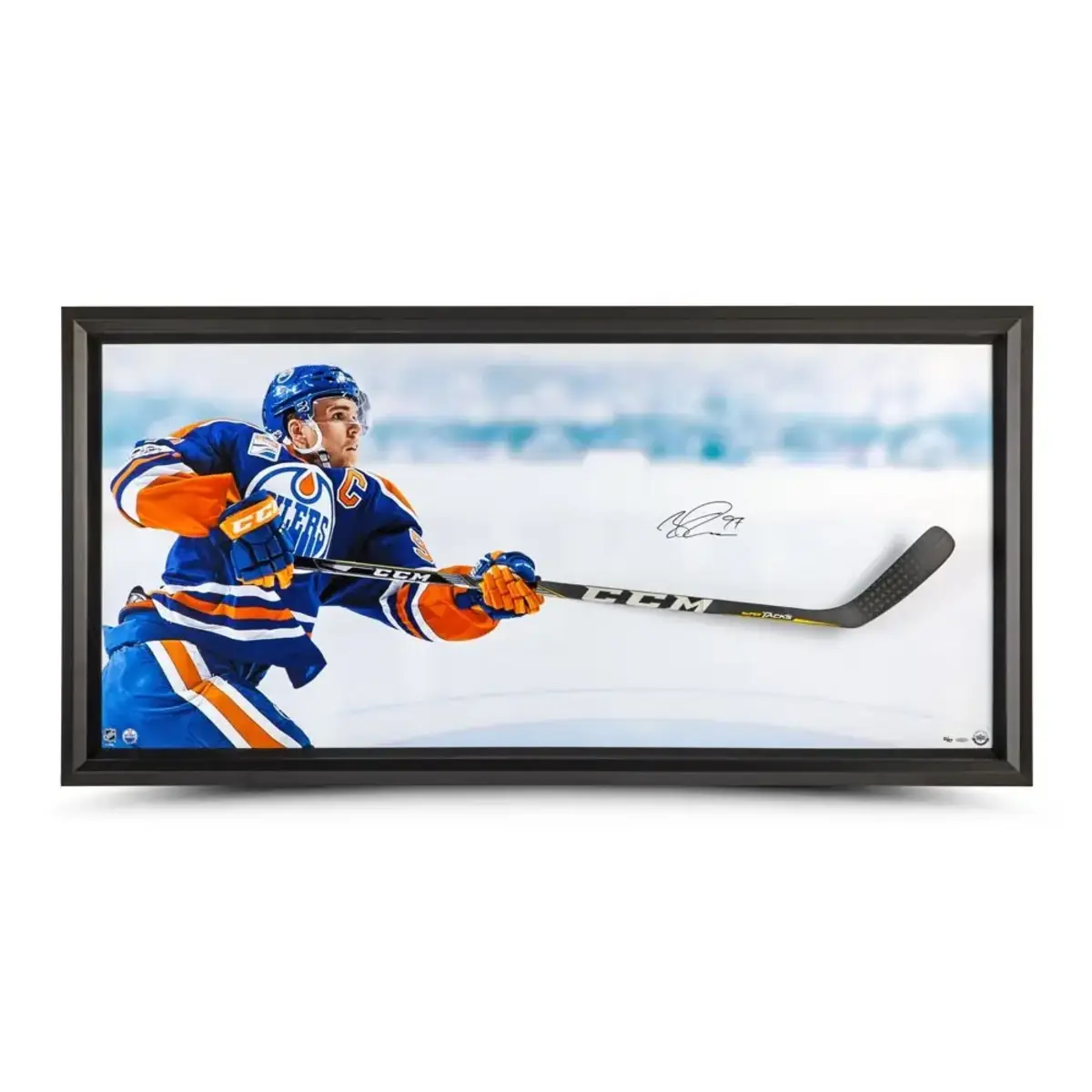 A Connor McDavid "Sharpshooter" limited-edition, autographed framed piece that features a CCM Ultra Tacks hockey stick breaking through the plexiglass.