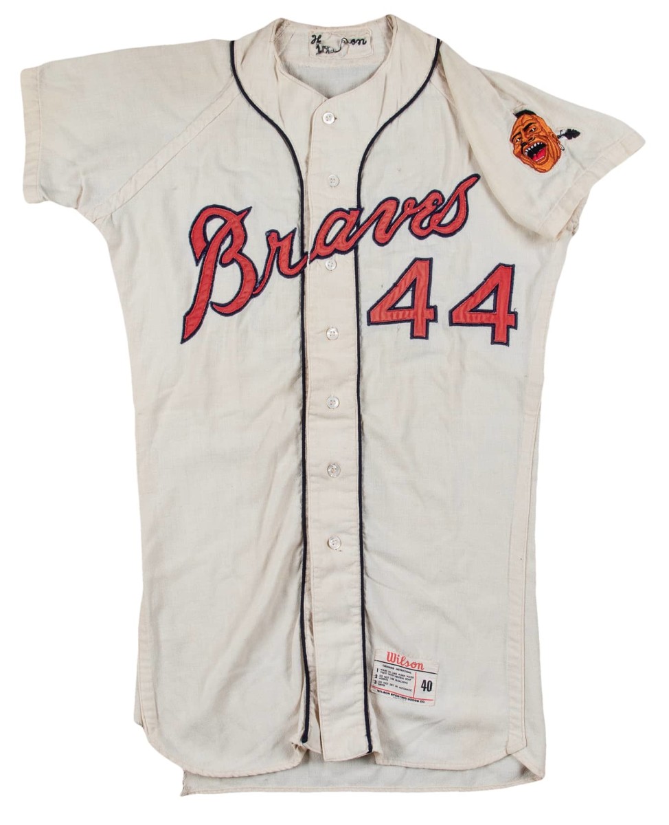 1964 Hank Aaron game-used Milwaukee Braves home jersey was worn by Aaron in 1963, when he led the National League in home runs with 44.