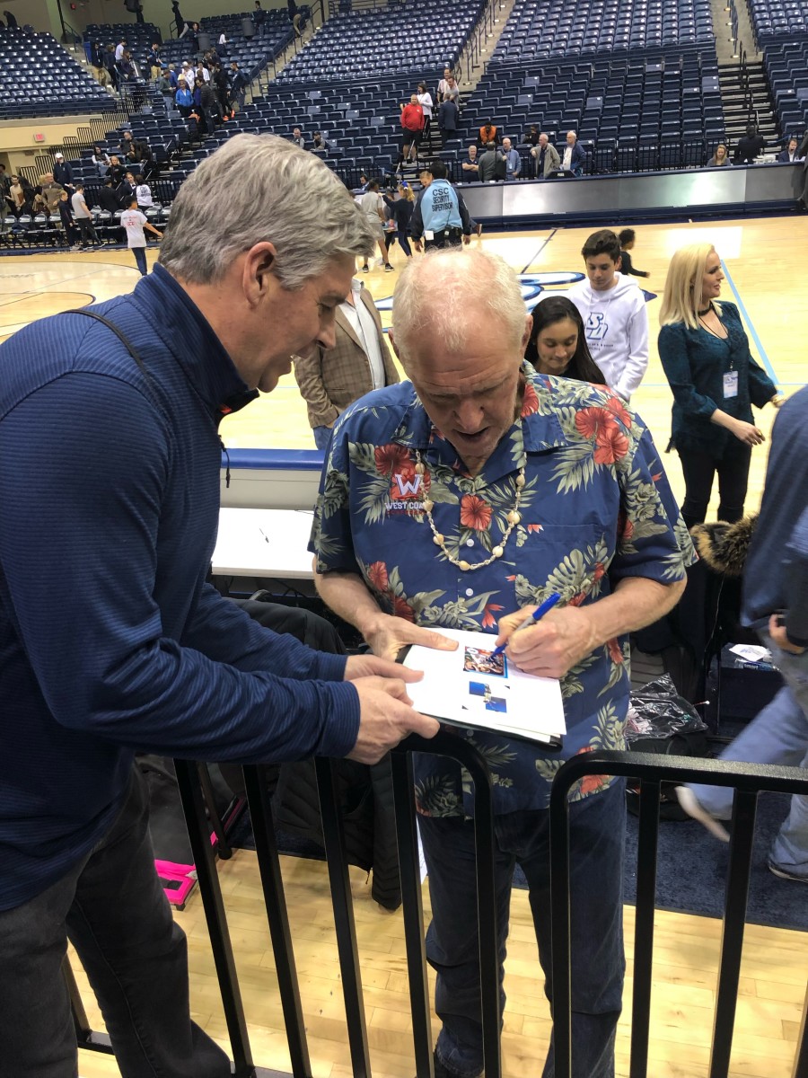 Tim Gallagher gets an autograph from NBA legend Bill Walton.