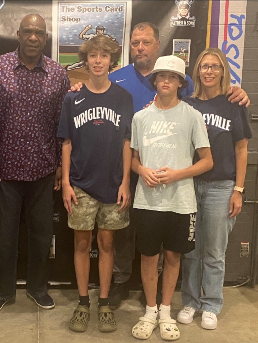 Baseball Hall of Famer Andre Dawson poses with the Gotcher family at The Sports Card Shop in New Buffalo, Mich.