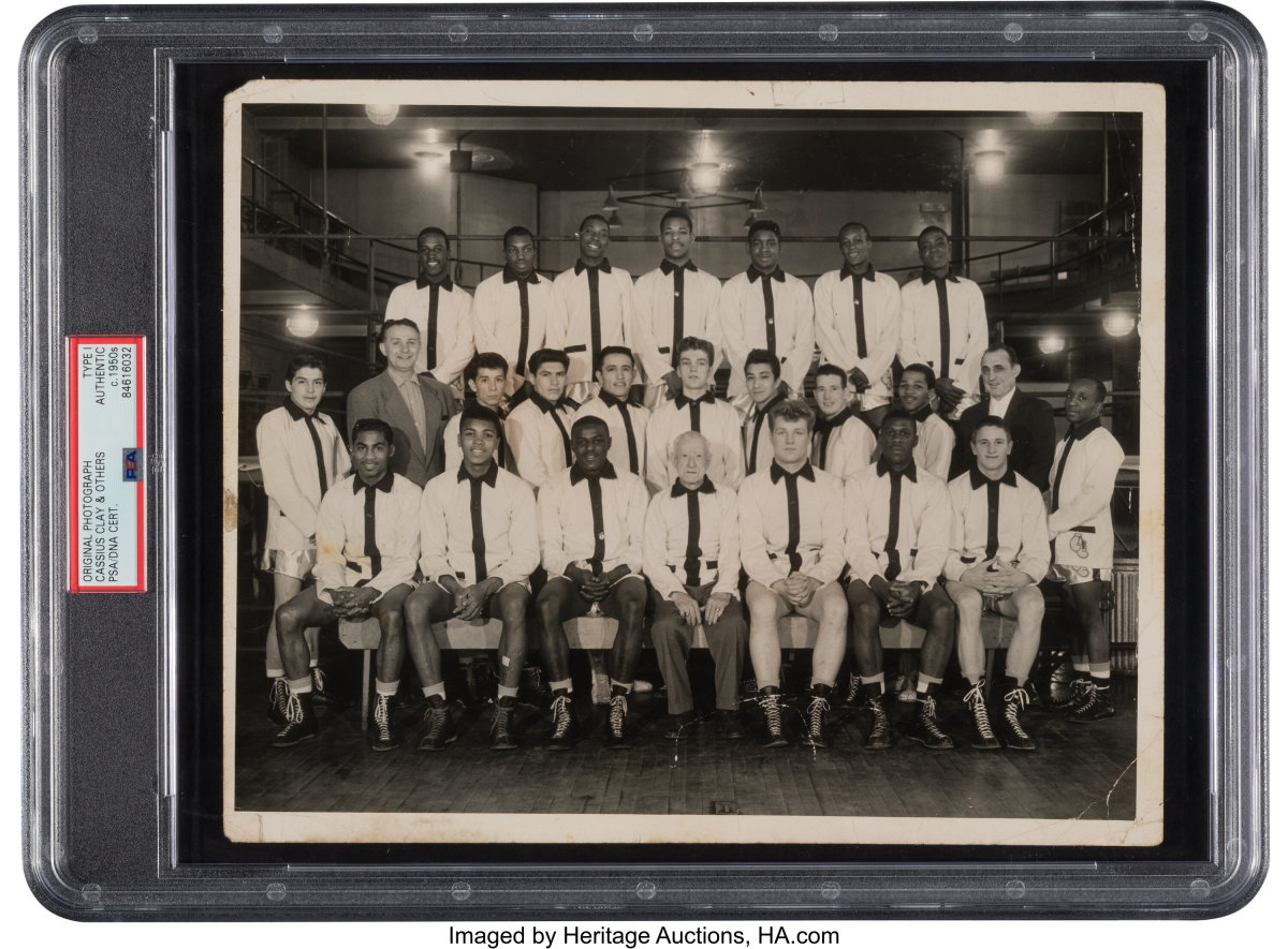 A 1960 Intercity Golden Gloves team-signed photograph that bears what's likely Cassius Clay's first autograph.