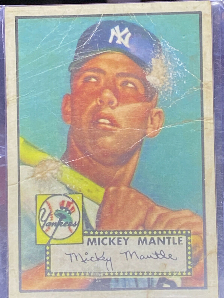 An ungraded, badly damaged 1952 Topps Mickey Mantle card that sold for $10,000.