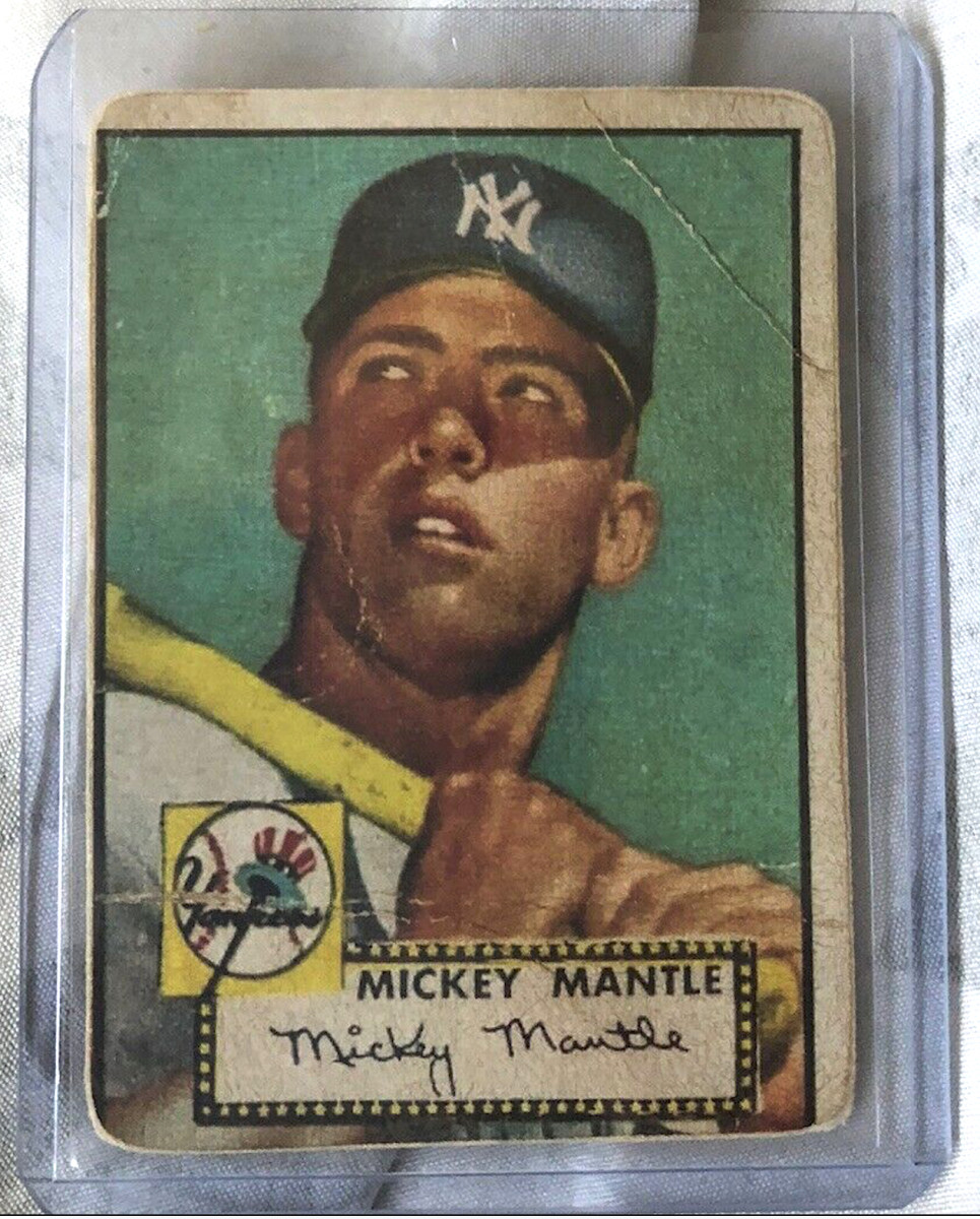 A creased and poorly centered 1952 Topps Mickey Mantle card that sold online for $10,000.
