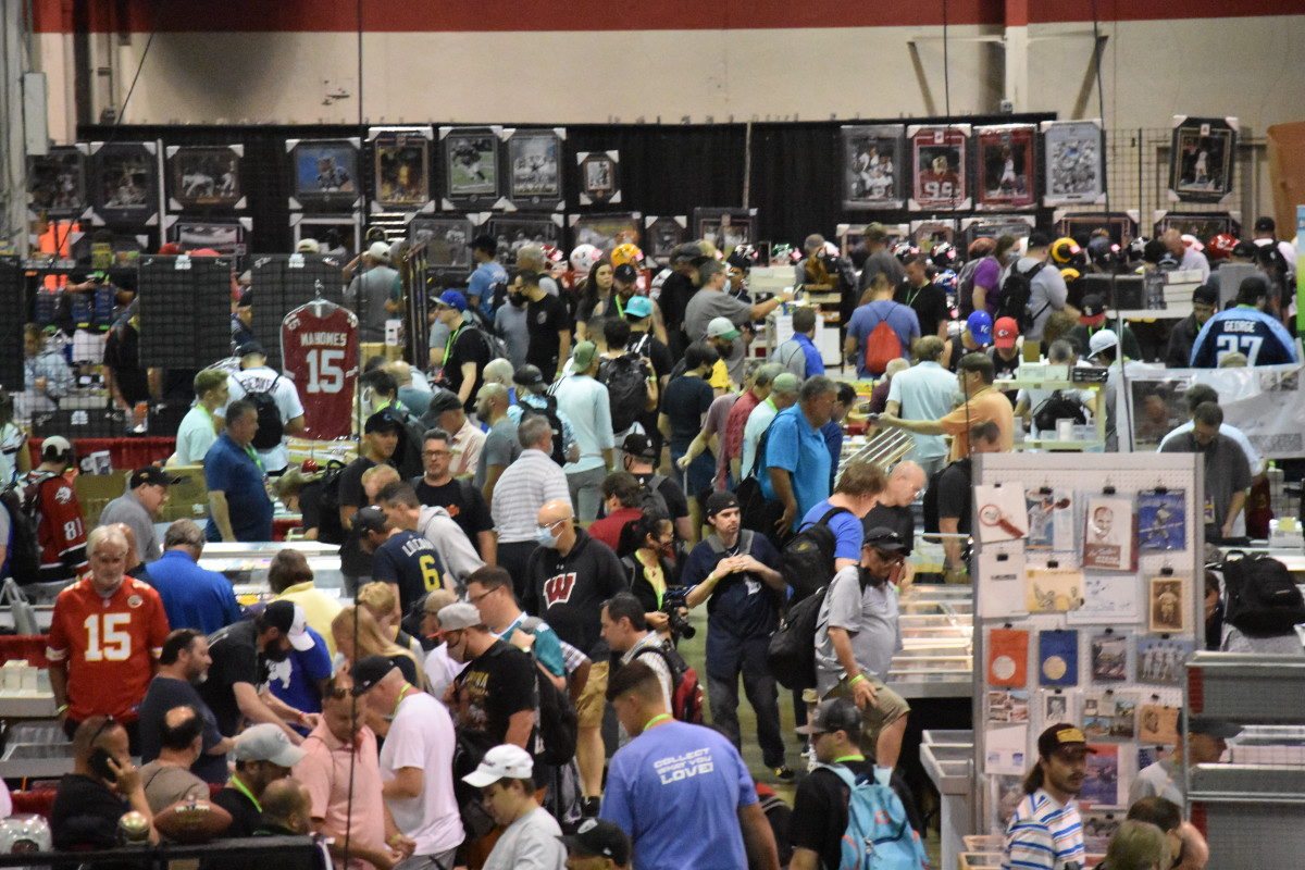 Dealers and collectors flood the show floor of The National.