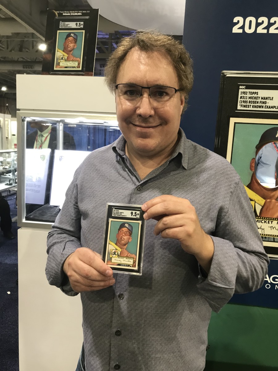 Derek Grady of Heritage Auctions shows off the 1952 Mickey Mantle with a 9.5 grade that is expected to set the all-time sports card record.