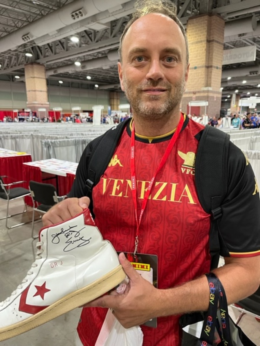 Cyril Goddeeris with a pair of 1984 Converse sneakers signed by Dr. J Julius Erving.