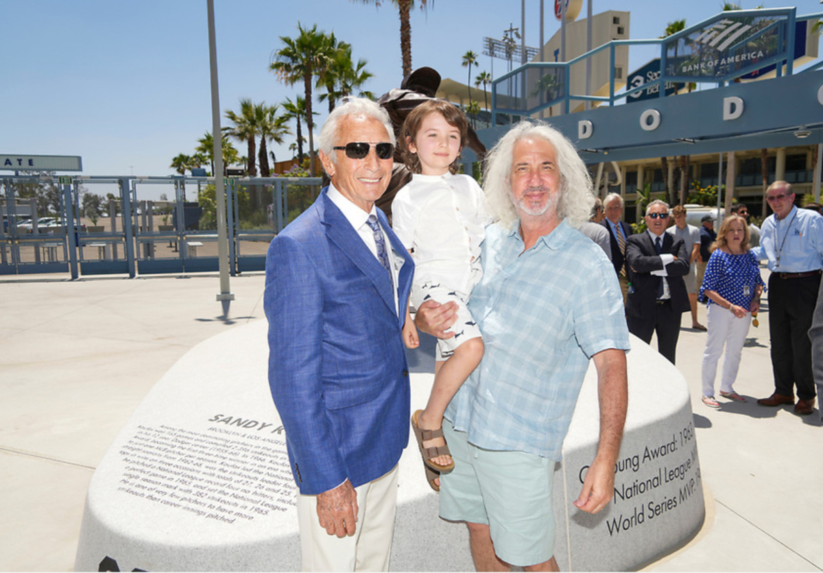 Harlan J. Werner (right) and his son, Nicholas, with Sandy Koufax outside Dodger Stadium.