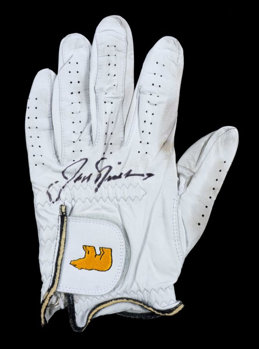 A game-worn and signed golf glove from Jack Nicklaus.