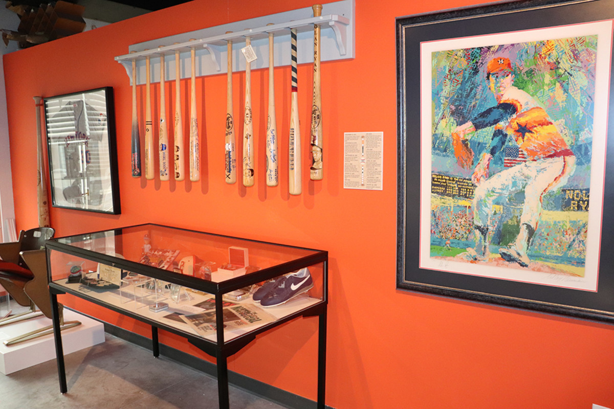 Some of the Nolan Ryan memorabilia from the Leo S. Ullman collection featured at the Noyes Arts Garage in Atlantic City, with one of the walls painted in Houston Astros’ orange.