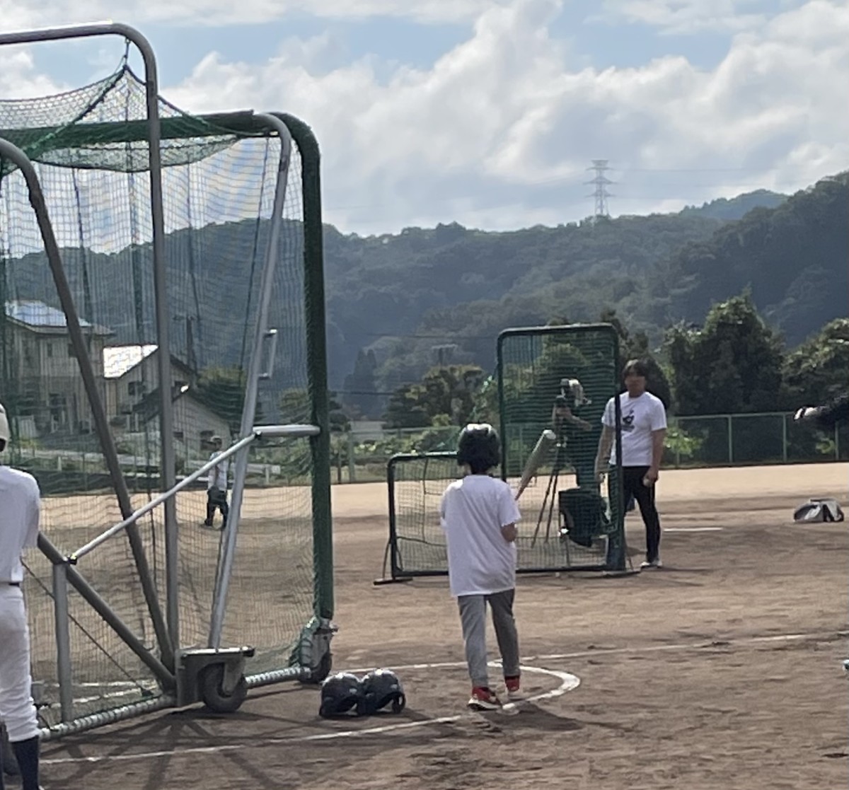 Hideki Matsui pitches to kids at his baseball clinic in Nomi, Japan.