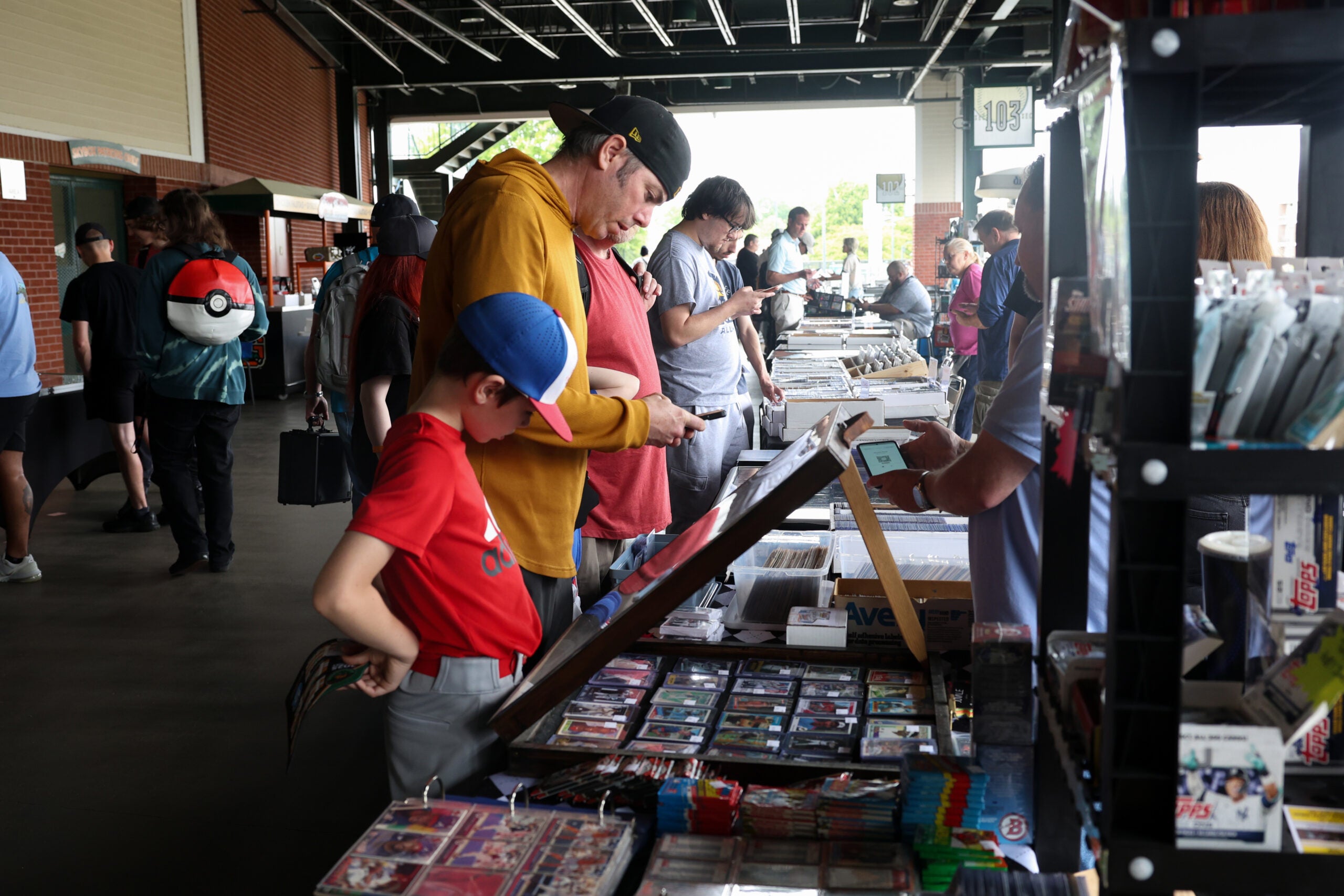 A father and son shop for cards at First National Bank Field in Greensboro, N.C. 