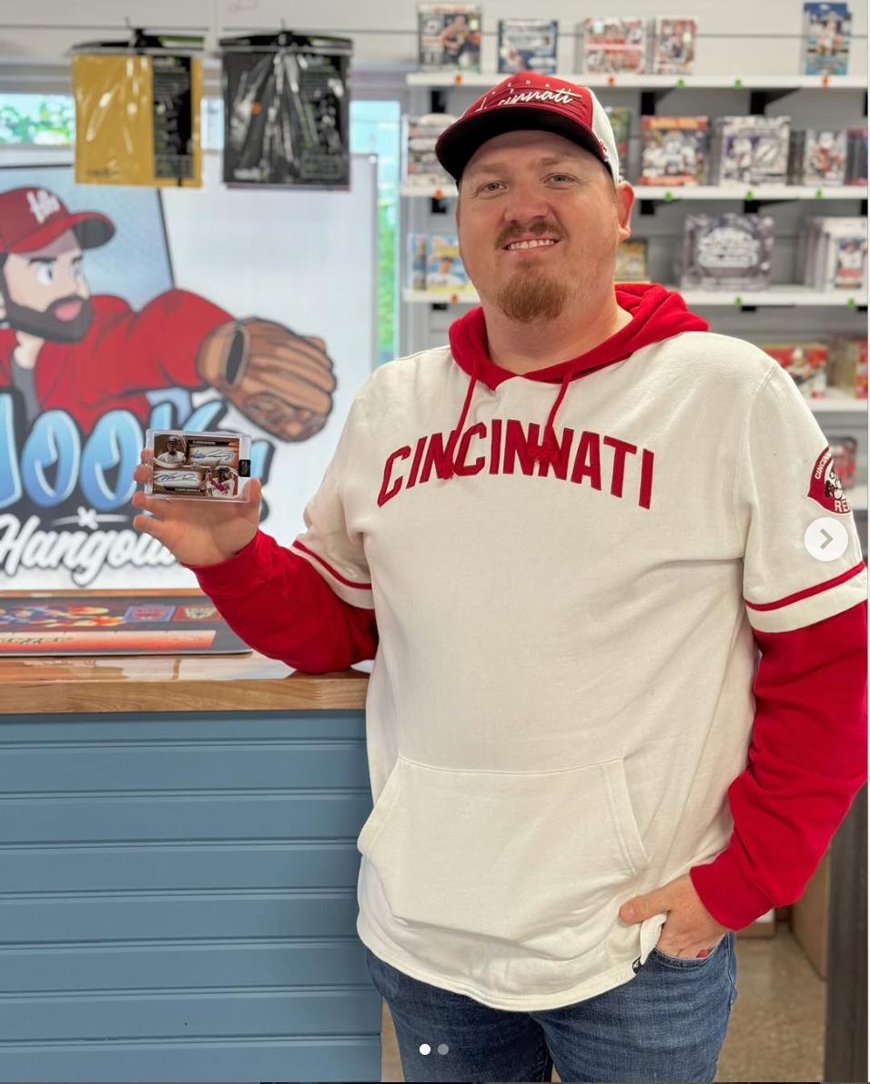 A Cincinnati Reds fan shows off a big pull at Hoov's Hangout. 