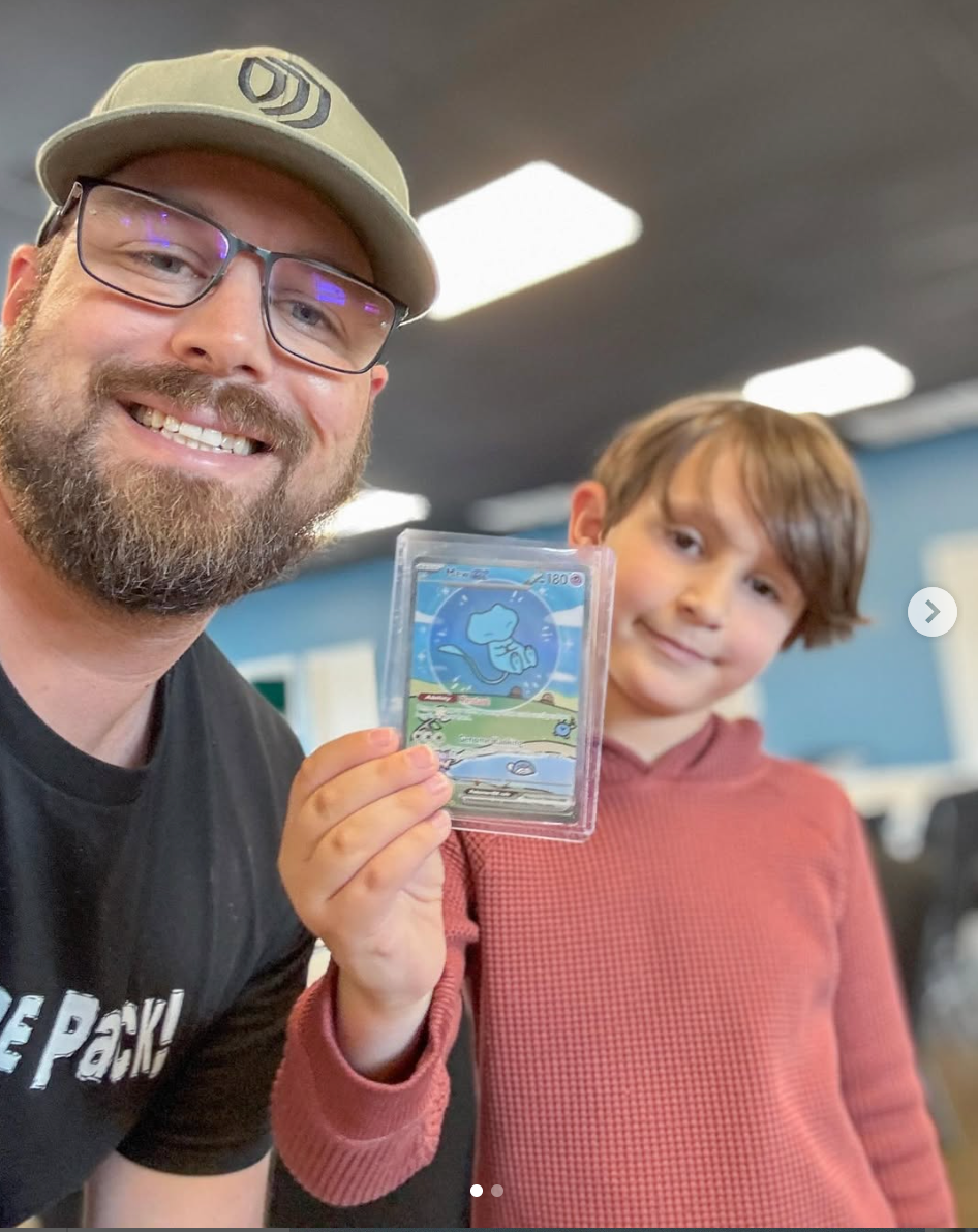 Former MLB pitcher J.J. Hoover with a young collector at Hoov's Hangout. 