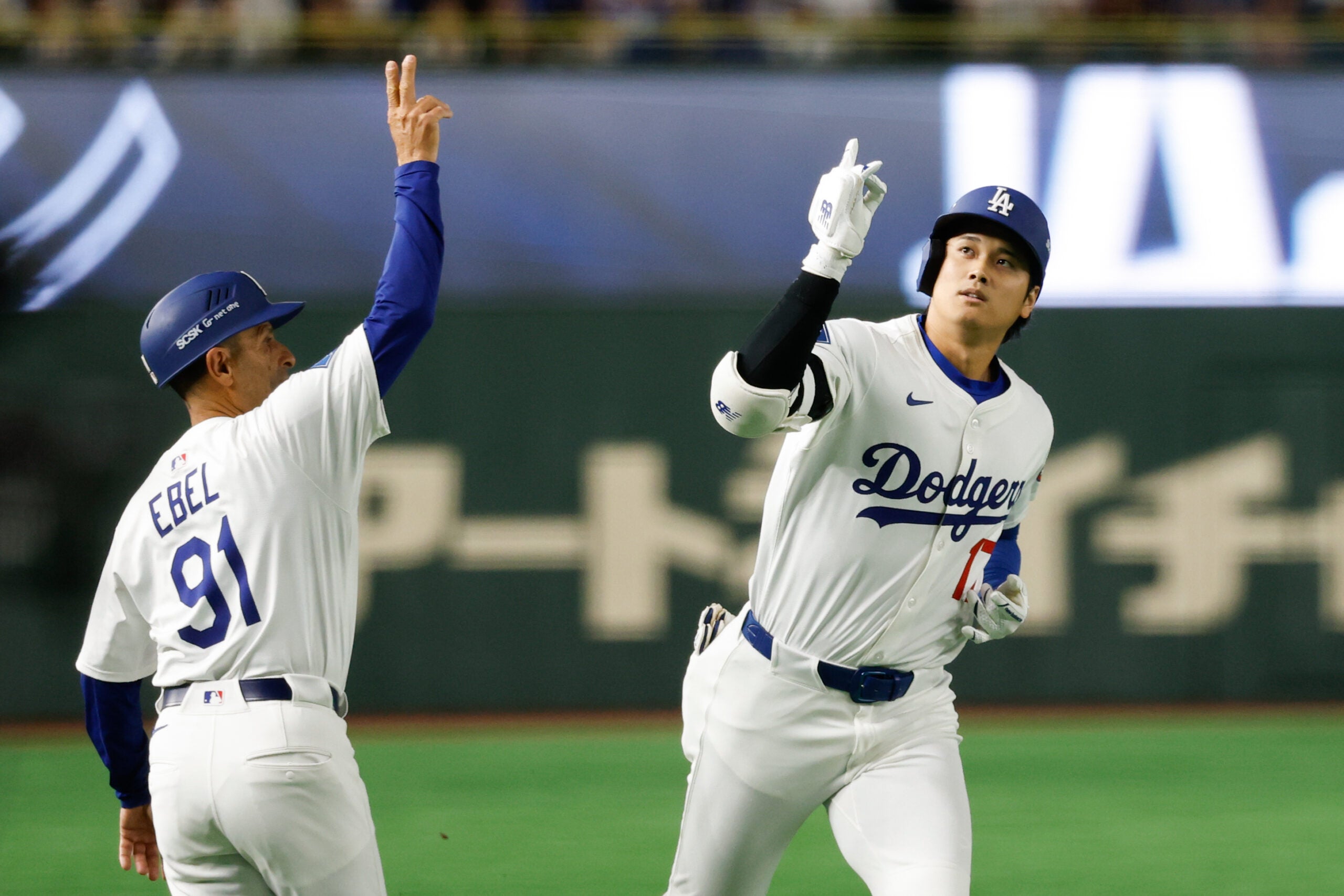 Shohei Ohtani celebrates with third base coach Dino Ebel after hitting a home run in the Tokyo Series against the Chicago Cubs at the Tokyo Dome. (Photo by Yuki Taguchi/MLB Photos via Getty Images)