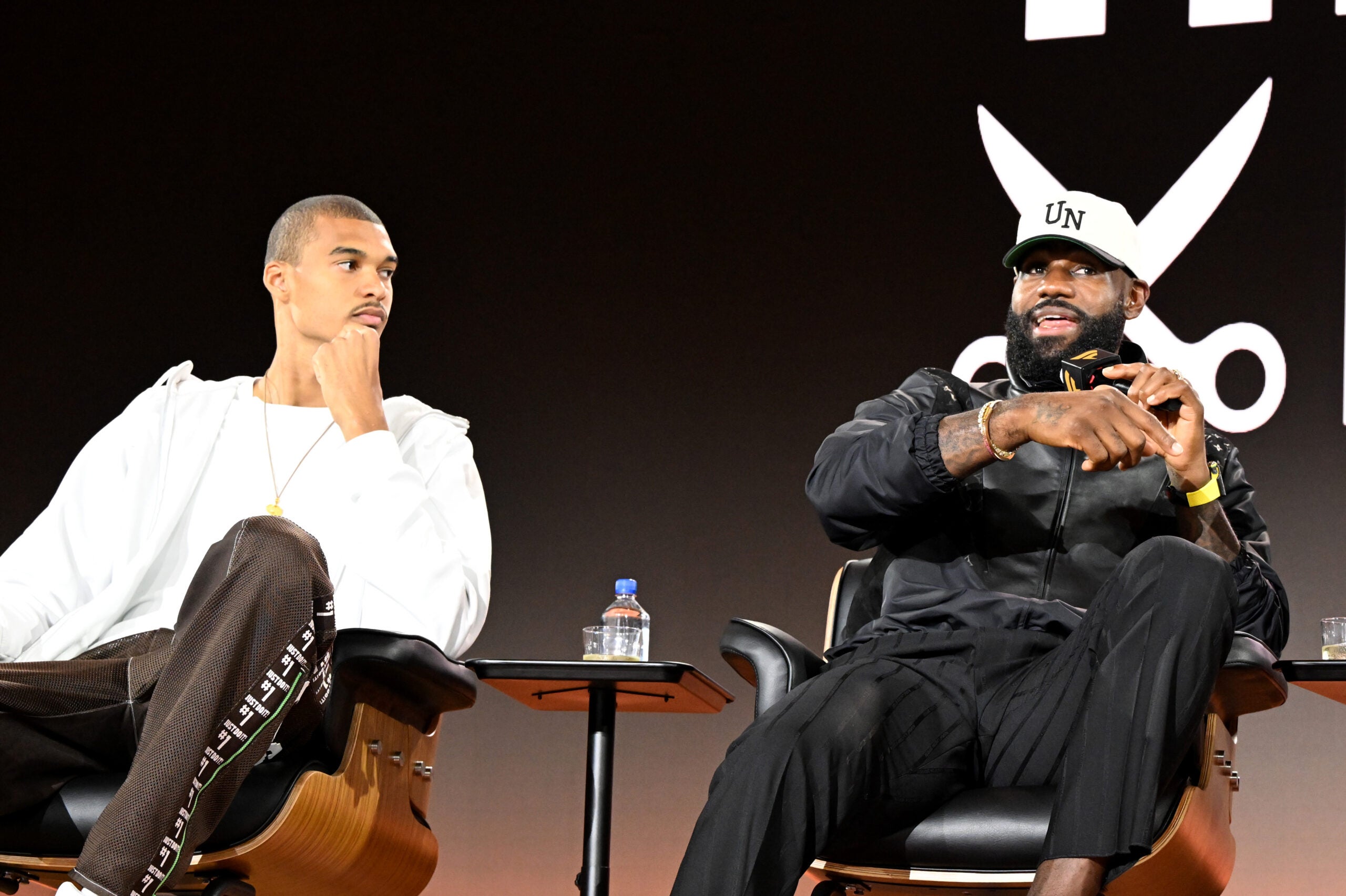Victor Wembanyama and LeBron James on stage together at Fanatics Fest NYC. 