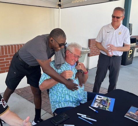 Hurdle gets a hug from former major league player Charlie Hayes at Spring Training. 