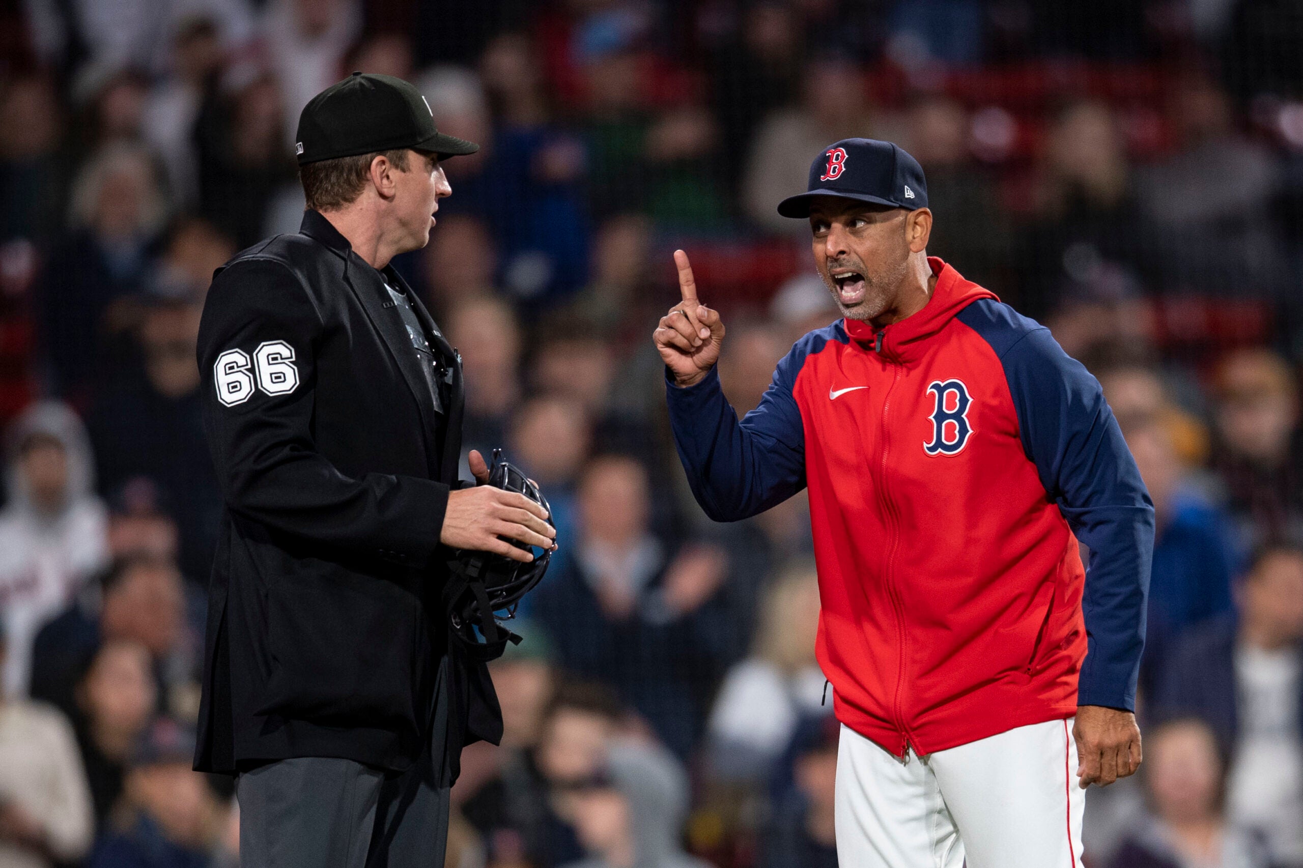Red Sox manager Alex Cora argues with umpire Alex Tosi at Fenway Park in 2024. 