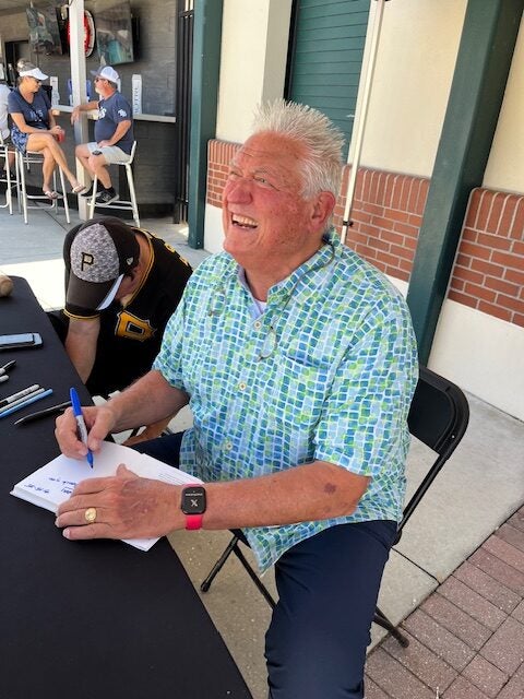 Clint Hurdle signs autographs at Pirates spring training. 
