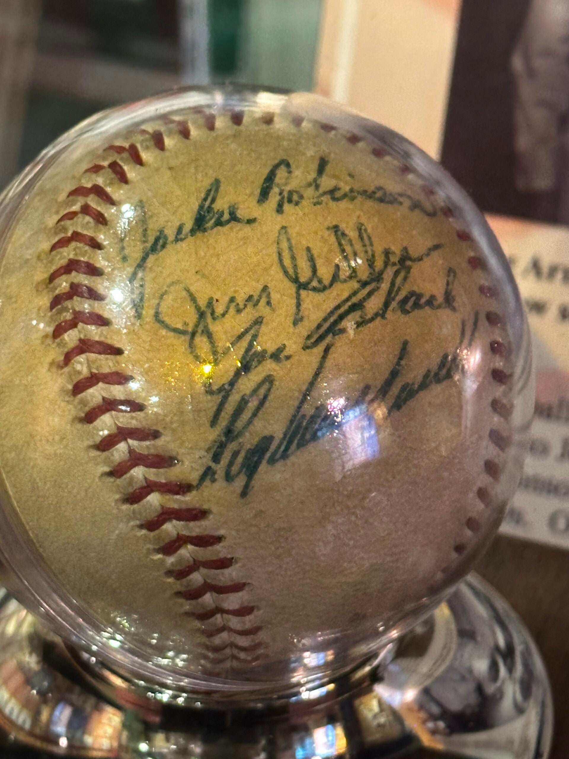 Baseball signed by Jackie Robinson, im Gilliam, Joe Black, and others at the Negro Leagues Baseball Museum. 