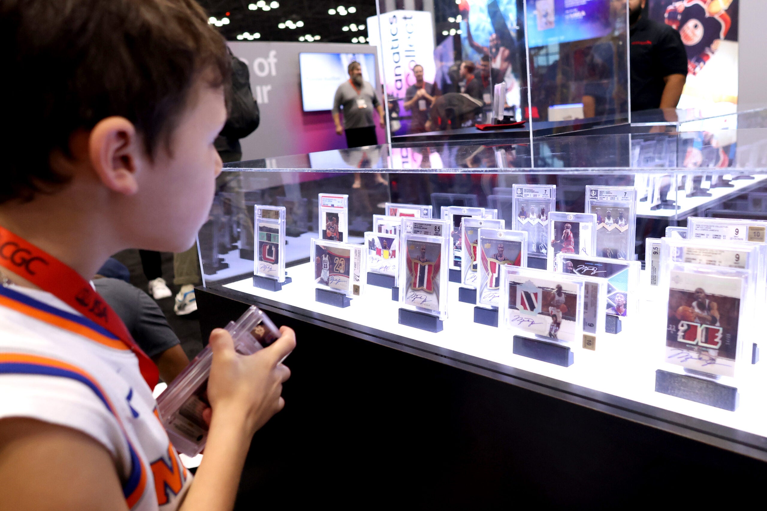 A young collector checks out cards at FFNYC 2024. 
