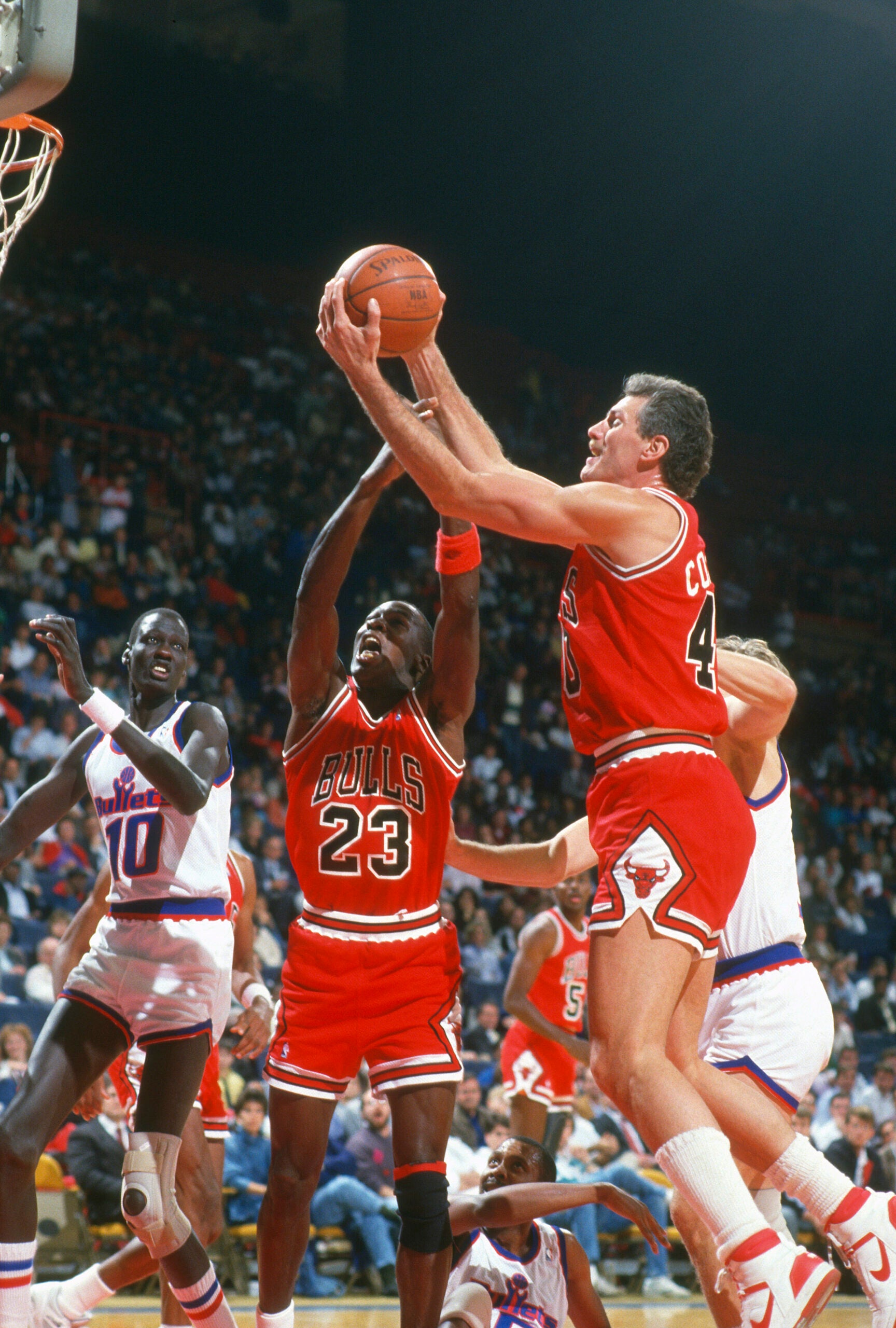 Dave Corzine fights for a rebound with teammate Michael Jordan in 1987.