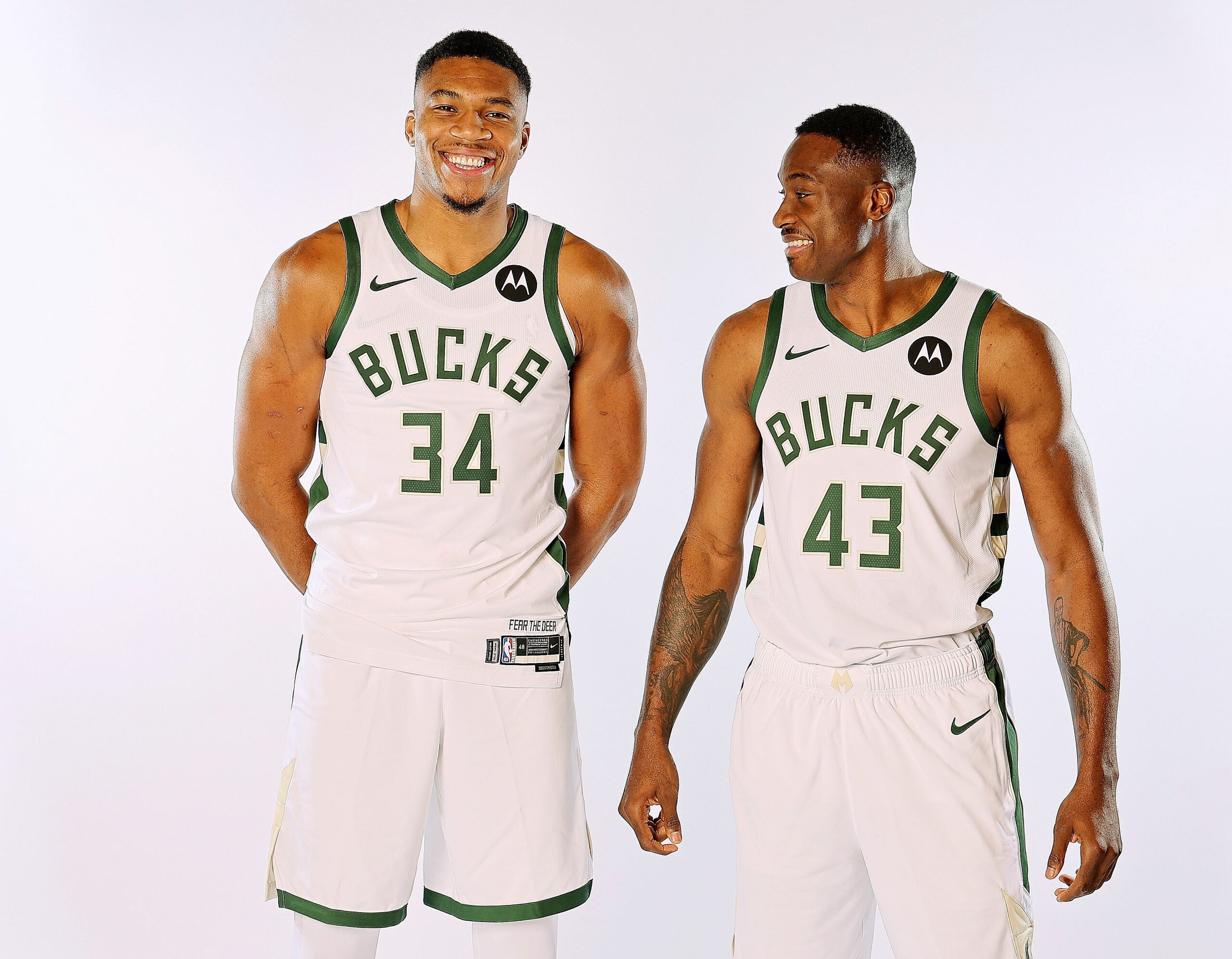 Giannis and Thanasis Antetokounmpo pose for photos during media day for the Milwaukee Bucks in 2023. 