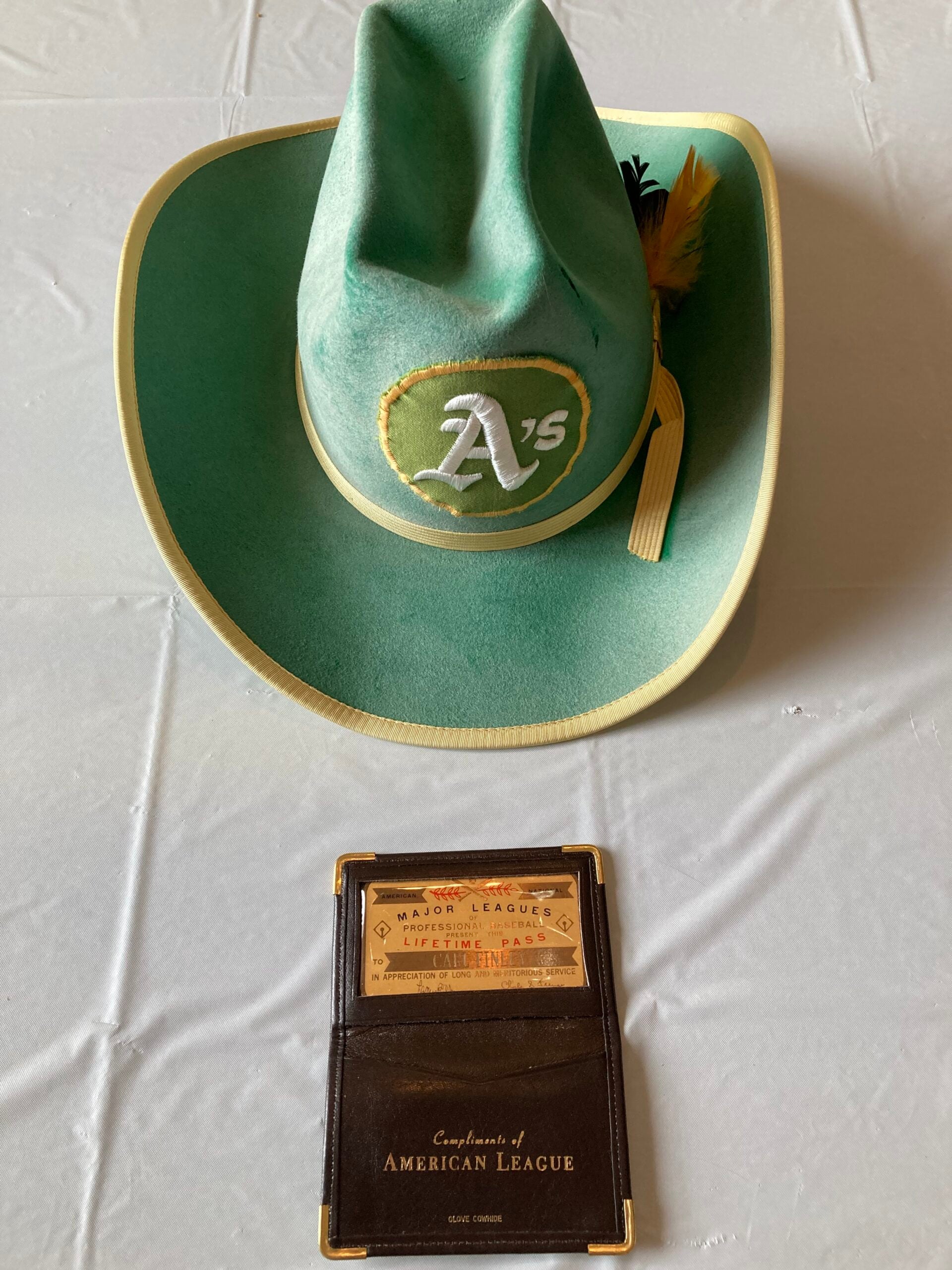 Charlie Finley's cowboy hat and MLB pass. 
