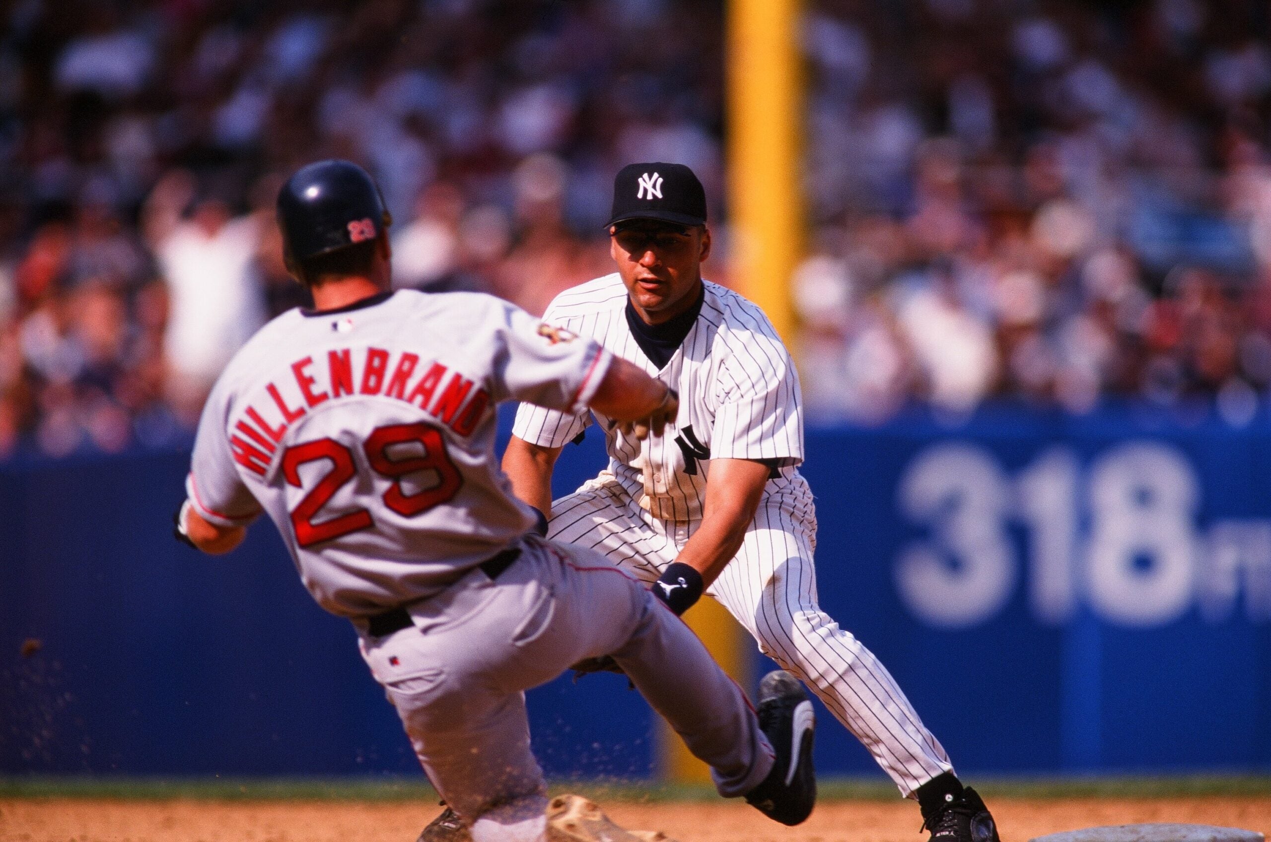 Shea Hillenbrand slides in hard against New York Yankees shortstop Derek Jeter at Yankee Stadium in 2001. 
