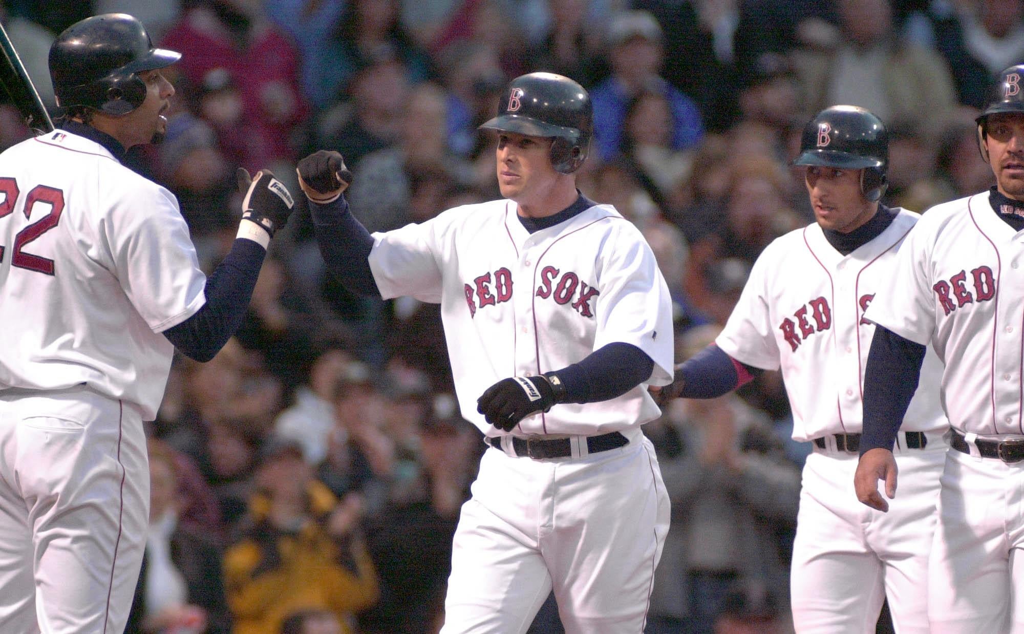 Shea Hillenbrand is congratulated by Red Sox teammates Tony Clark, Nomar Garciaparra and Brian Daubach after hitting a three-run homer in 2002 at Fenway Park. 