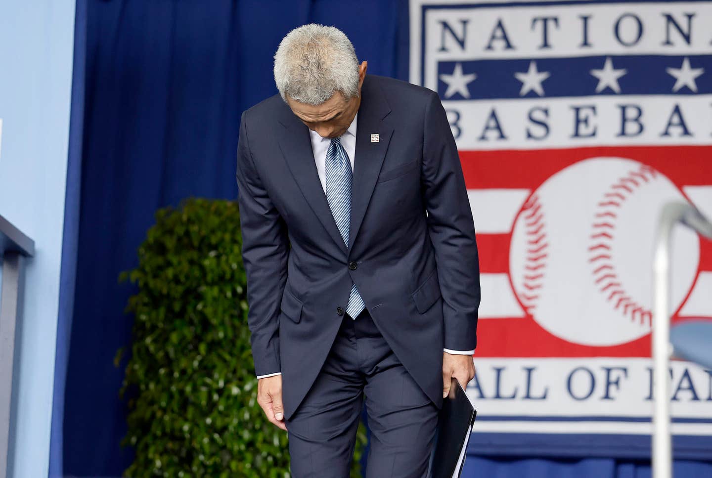 Ichiro Suzuki takes a bow after being introduced at the Baseball Hall of Fame.