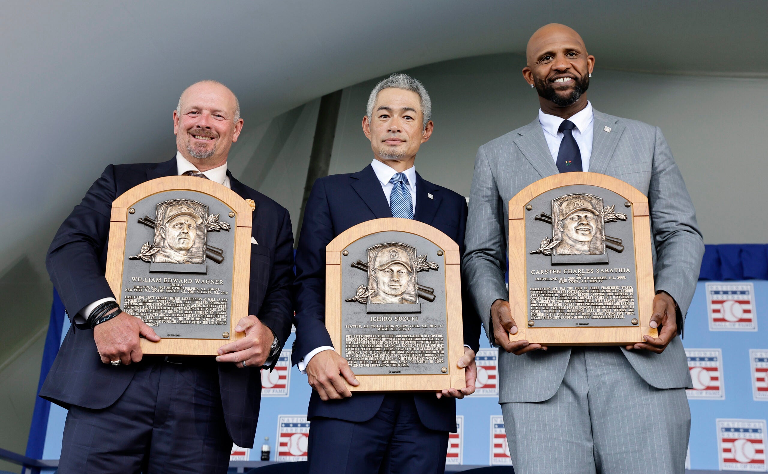 New Hall of Fame inductees (from left) Billy Wagner, Ichiro Suzuki and CC Sabathia pose with their plaques during the Baseball Hall of Fame induction ceremony July 27. 