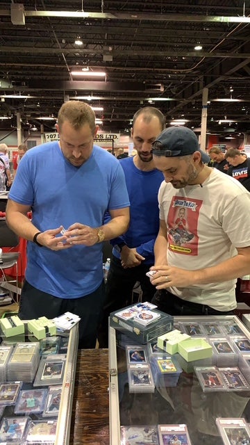 Jason Koonce (left) shops for cards with Gary Vee at The National. 