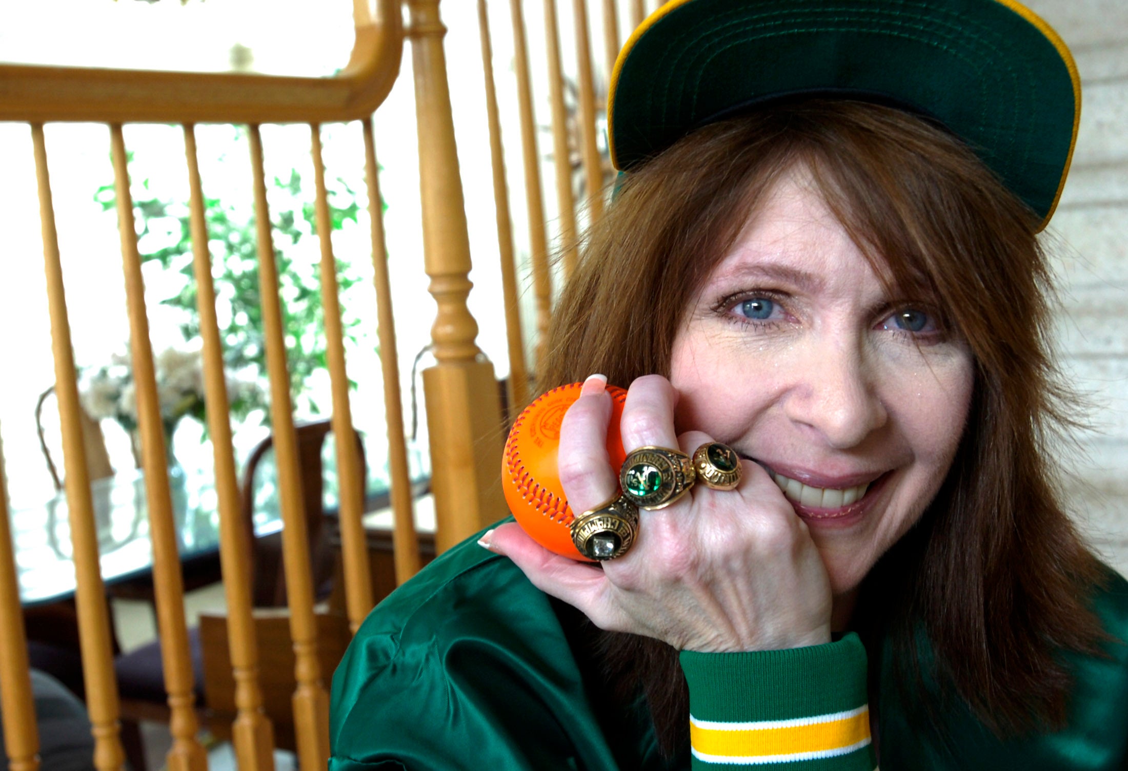 Nancy H. Finley, daughter of former A’s executive Carl Finley and niece of former A’s owner Charlie Finley, shows off some of her Oakland A’s memorabilia at her Dublin, Calif., home in 2011.