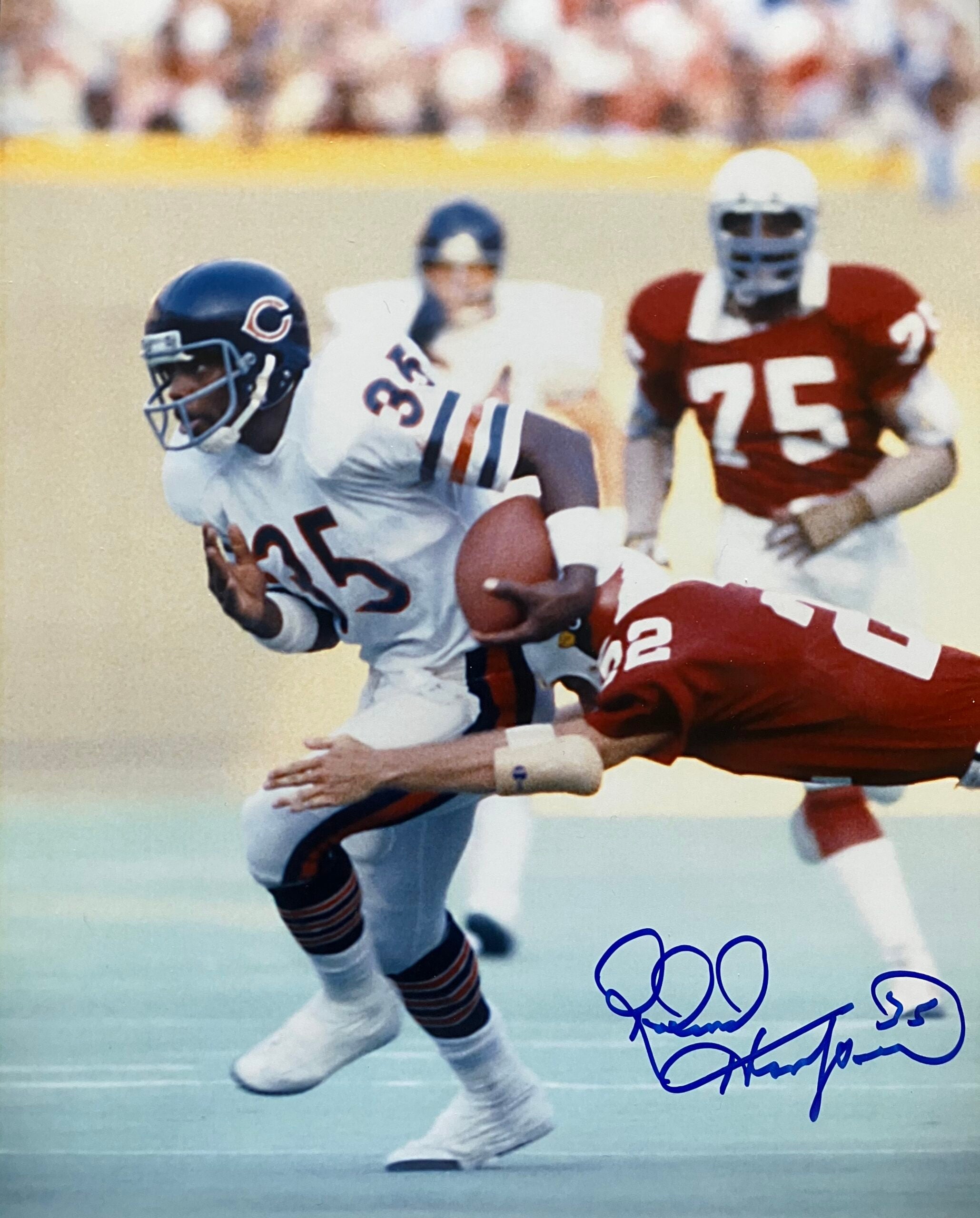 A signed photo of Roland Harper carrying the ball for the Bears. 