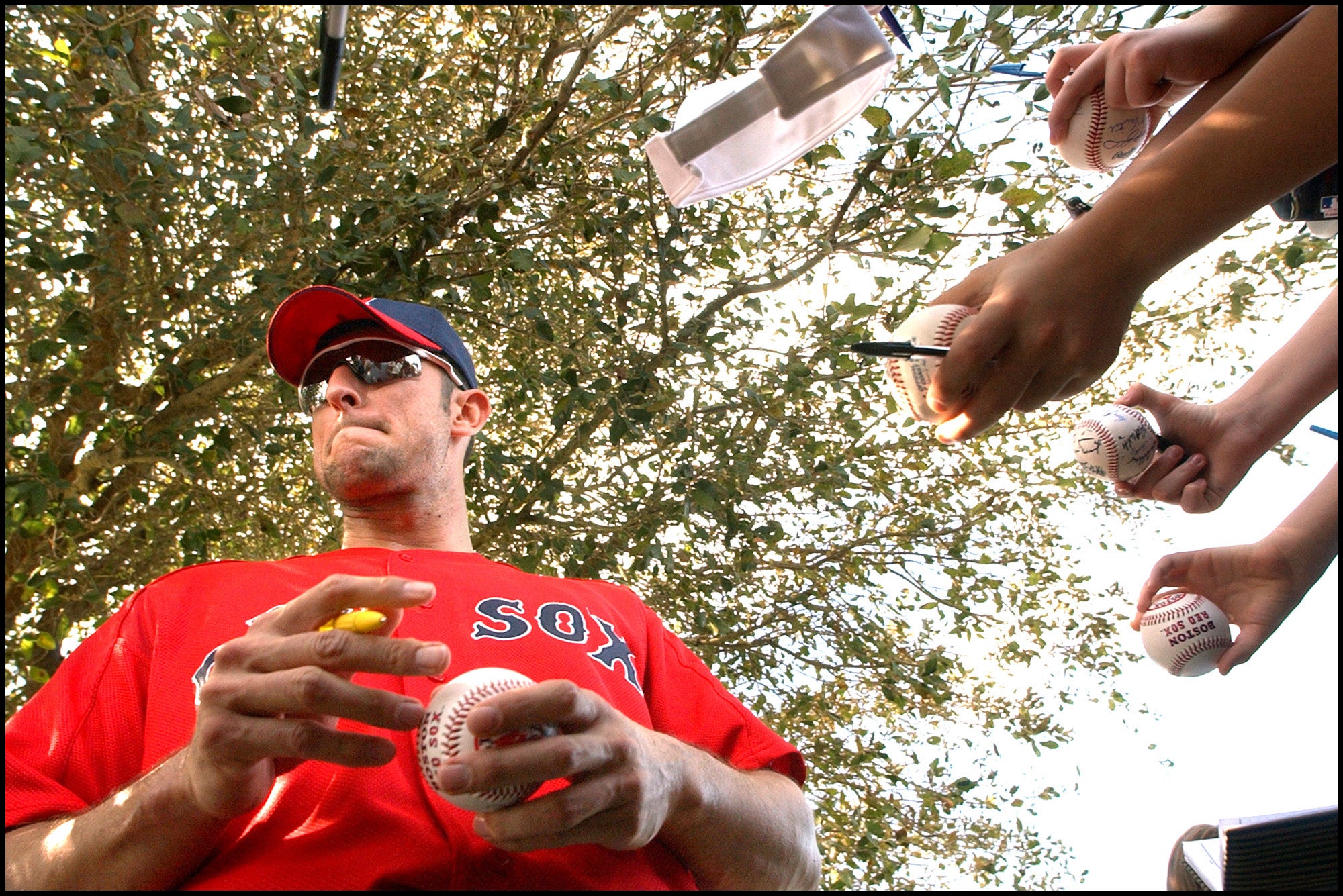 Shea Hillenbrand signs autographs at spring training in 2003. 