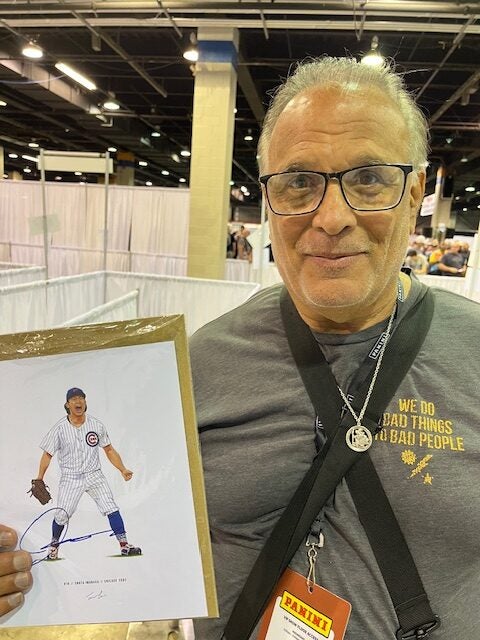 Longtime Cubs fan Sam Ditusa of Chicago with his signed sketch of Shota Imanaga. 