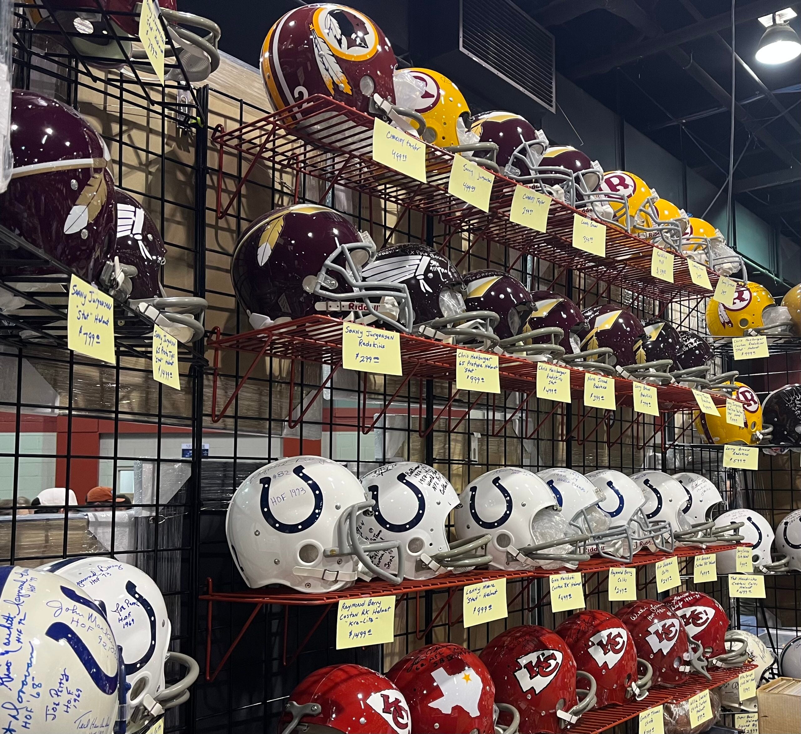 Autographed NFL helmets at The National. 