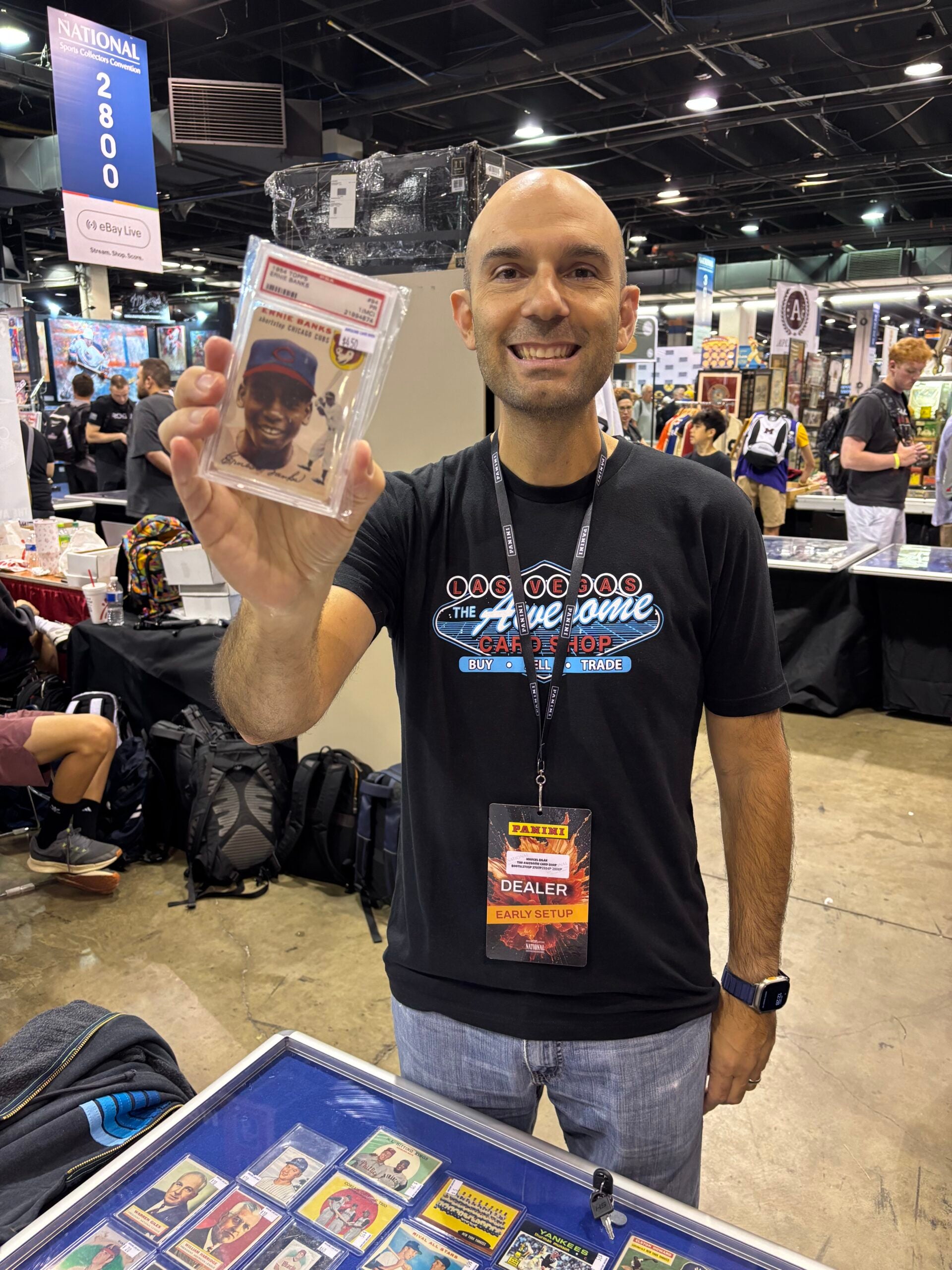Marcel Bilak, owner of Awesome Card Shop, with his Ernie Banks rookie card. 