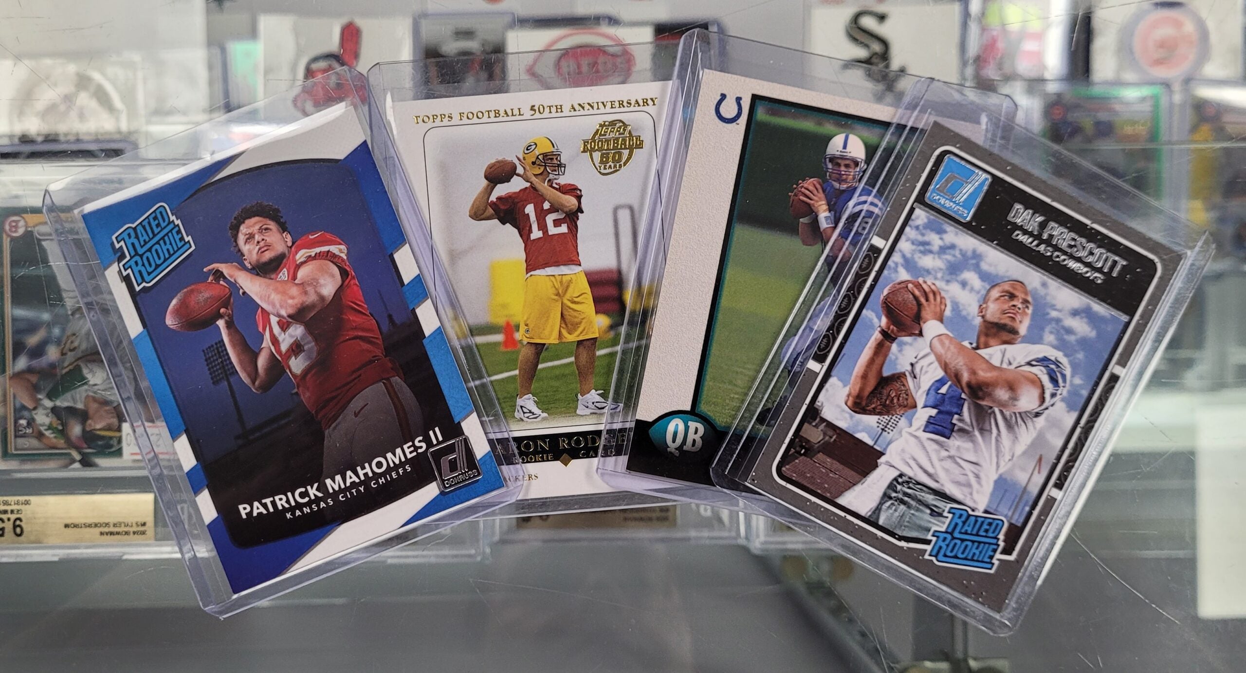 Hunter's collection of cards of NFL star QBs like Patrick Mahomes. 