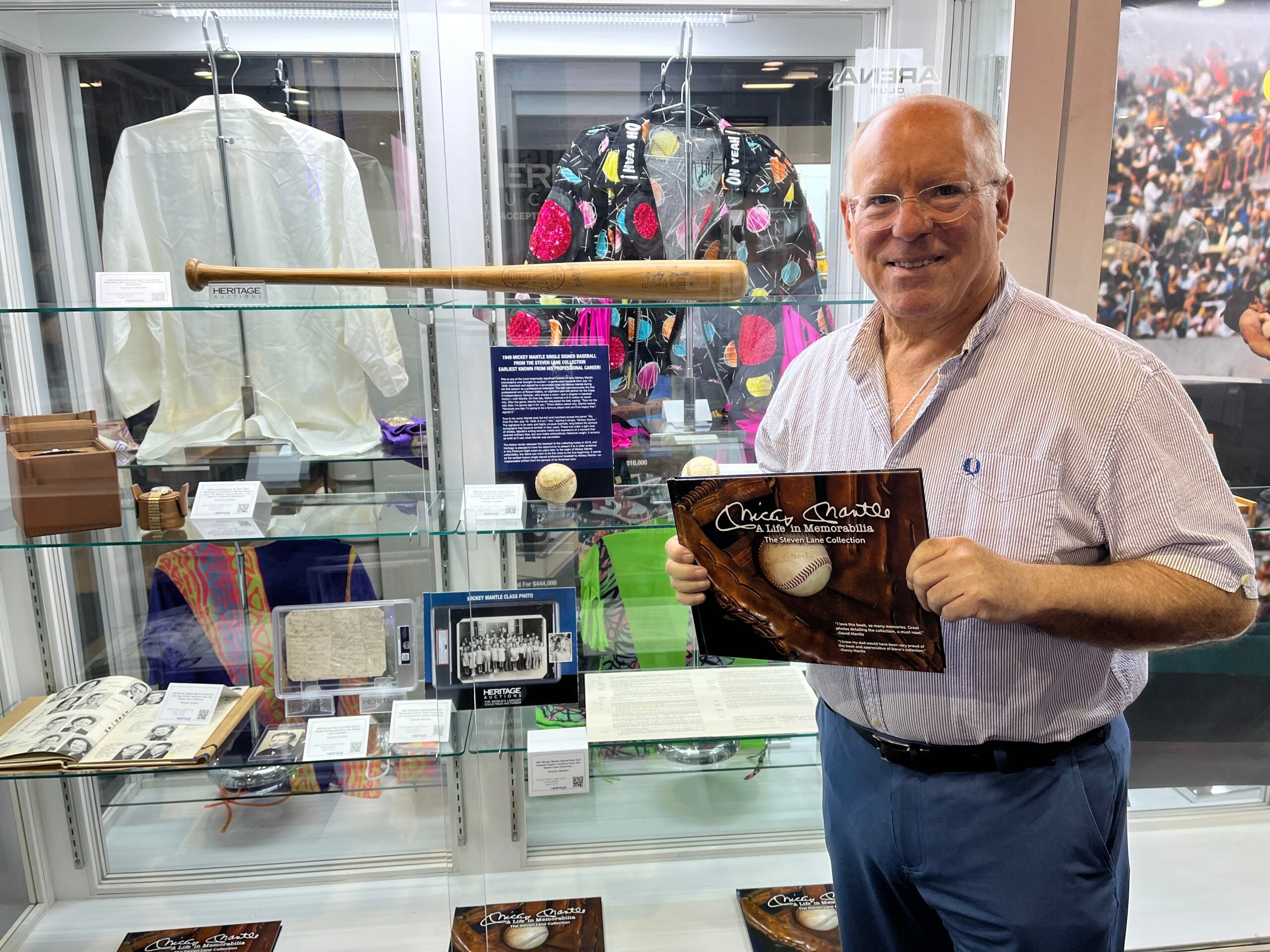 Steven Lane with part of his Mickey Mantle collection at the Heritage Auctions booth at The National. 