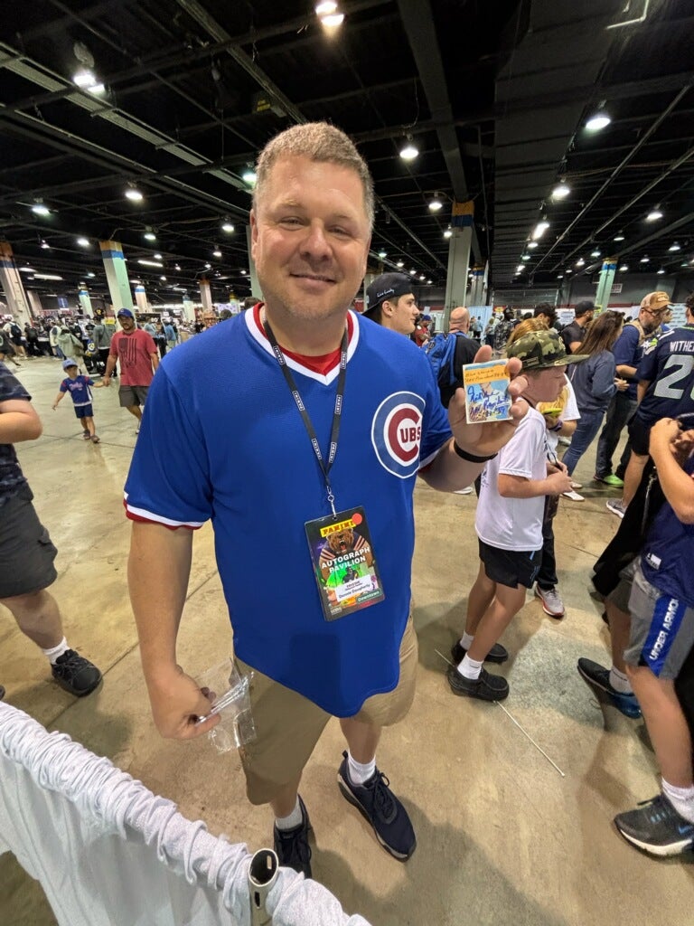Cubs fan Donnie Daugherty with his Rich Nye card for Signatures for Soldiers. 