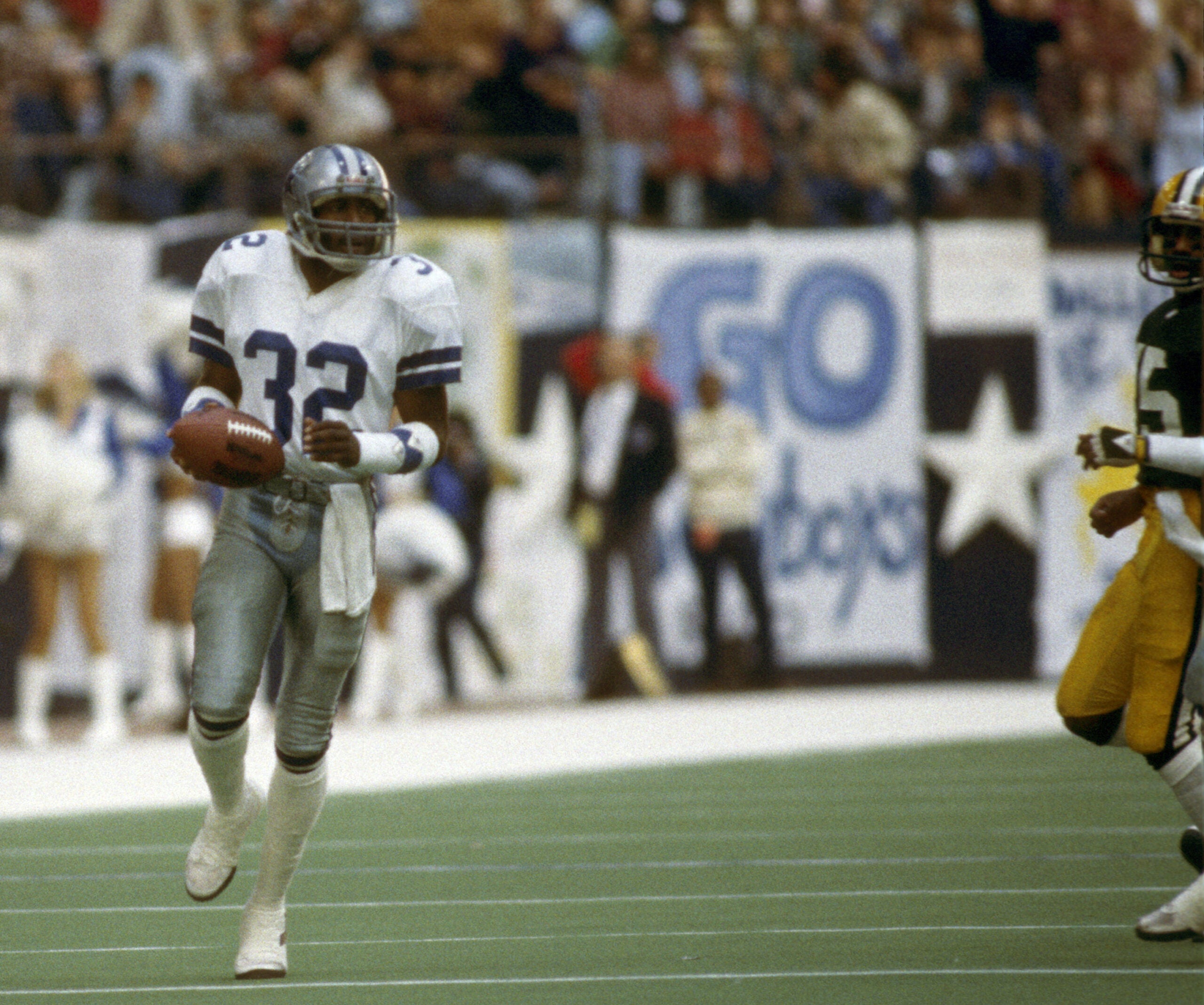 Dallas Cowboys cornerback Dennis Thurman returns an interception during the NFC Divisional Playoff against the Green Bay Packers on Jan. 16, 1983 at Texas Stadium. 