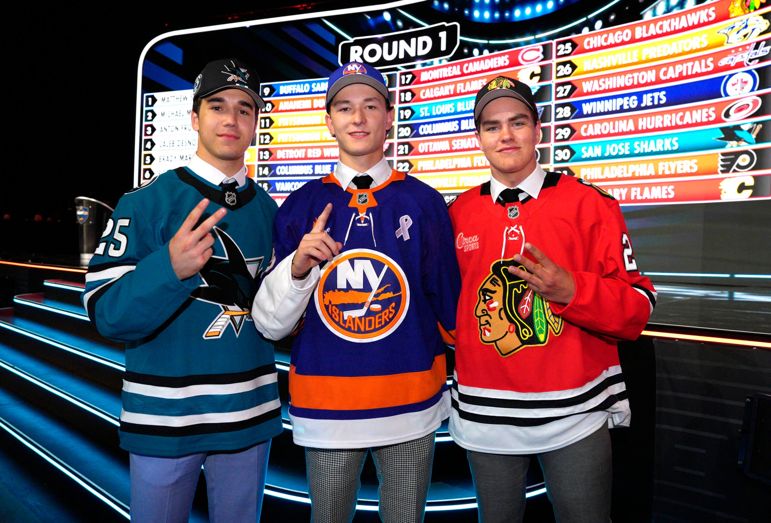 Top draft picks (from left) Michael Misa of the San Jose Sharks, Matthew Schaefer of the New York Islanders and Anton Frondell of the Chicago Blackhawks at the 2025 NHL Draft in Los Angeles. 
