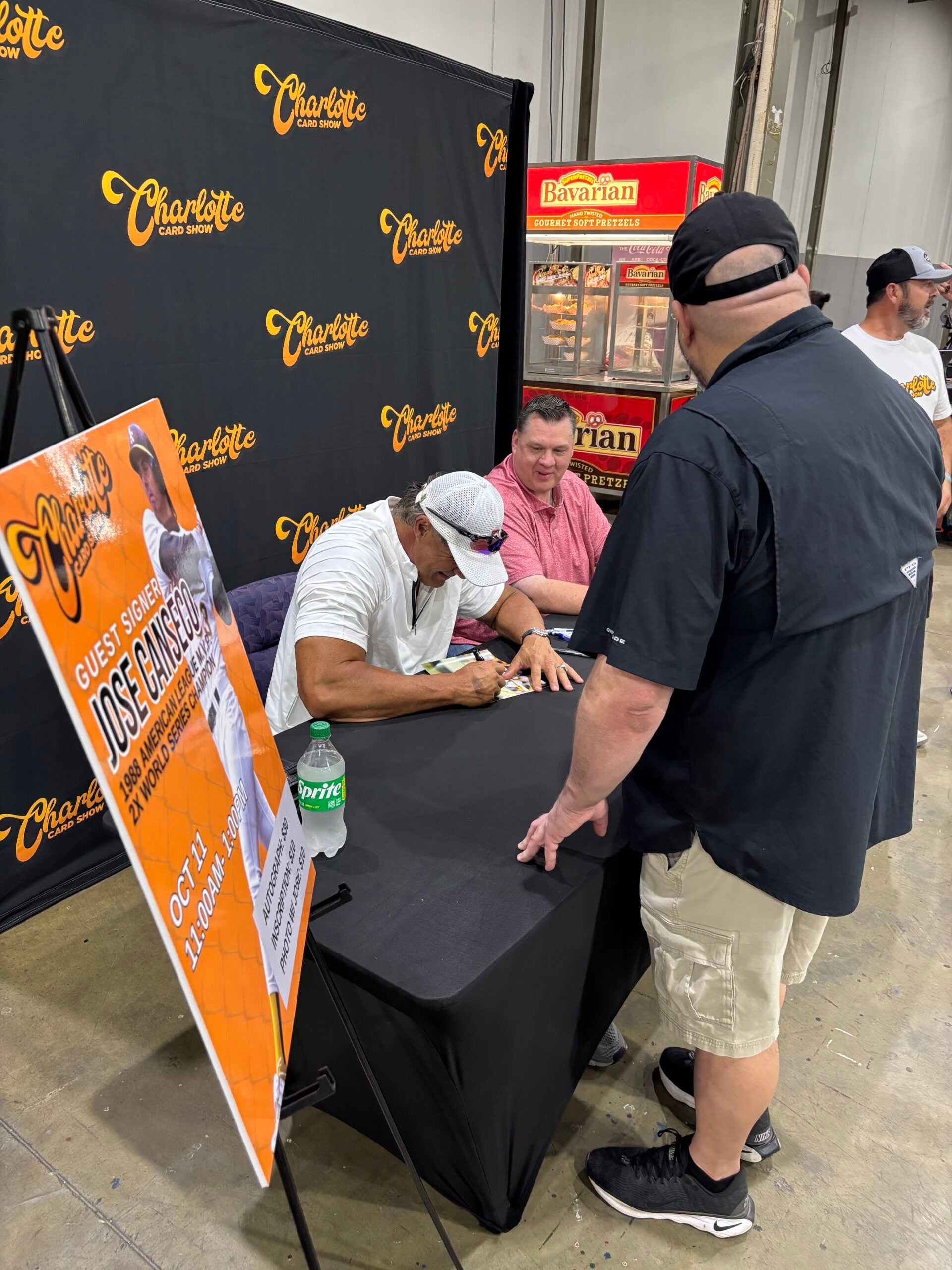 Former MLB star Jose Canseco signs autographs at the Charlotte Card Show. 