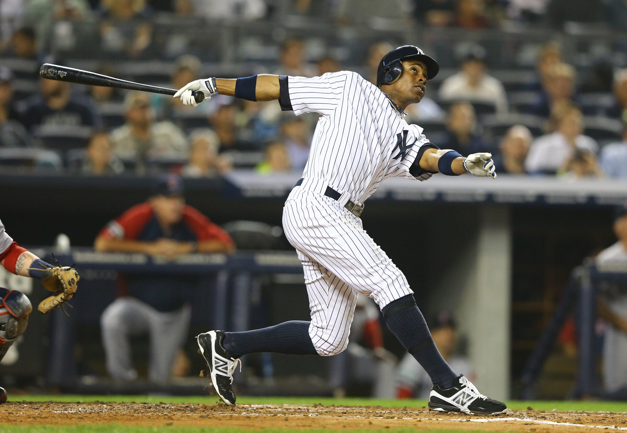 Cutline: Curtis Granderson hits a three run home run against the Boston Red Sox in 2012 at Yankee Stadium.