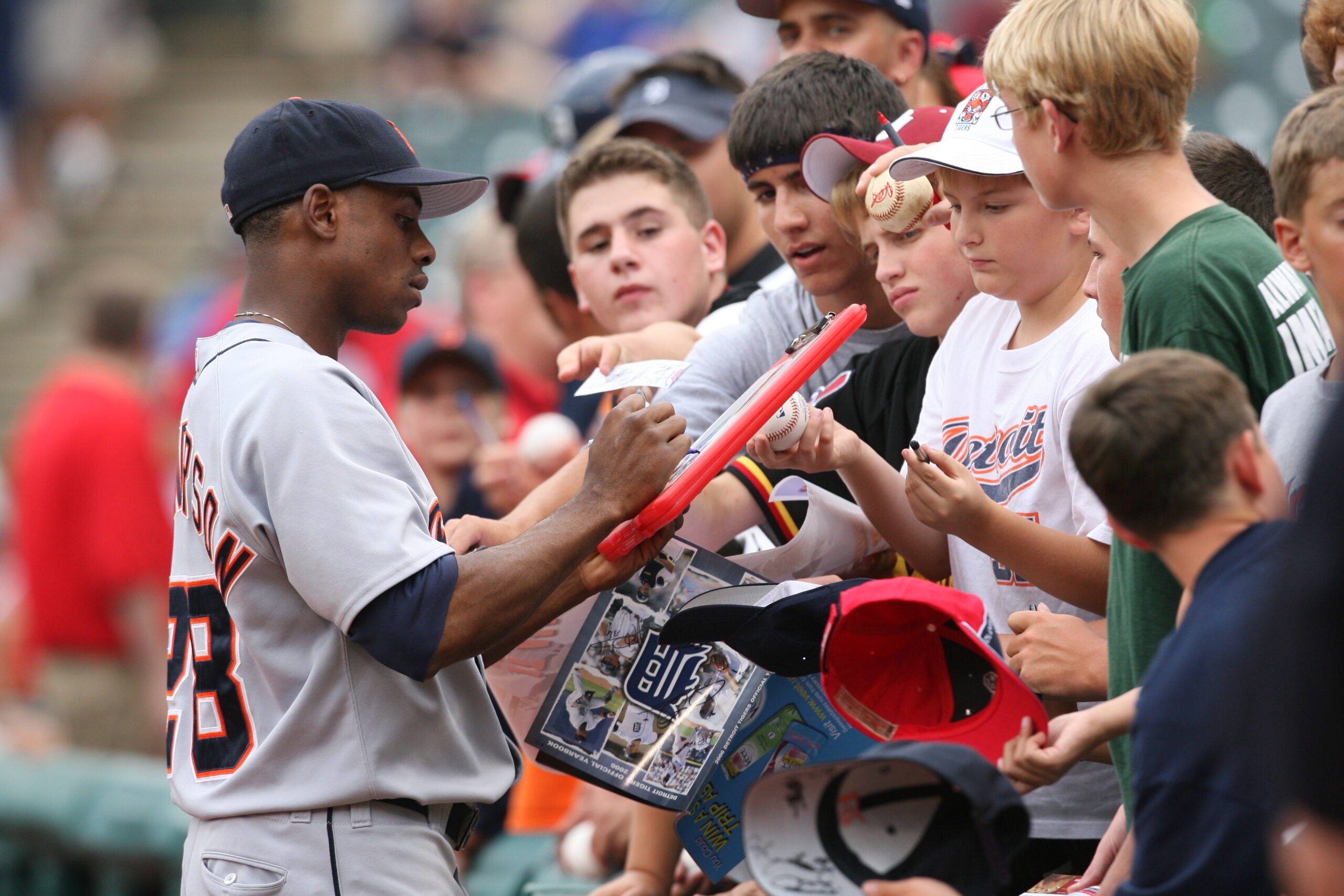 Curtis Granderson signs autographs for kids at Jacobs Field in Cleveland in 2006.