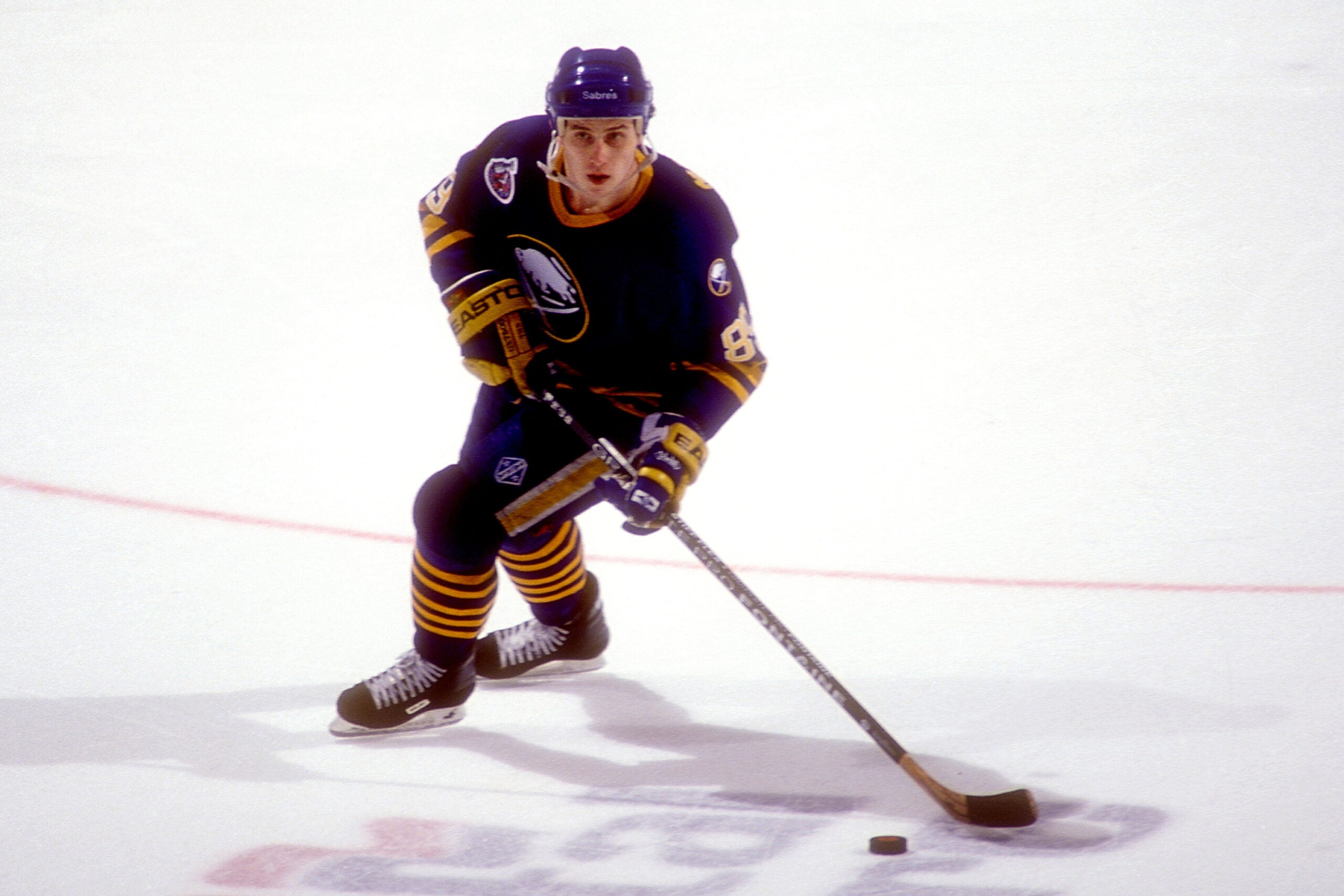 Alexander Mogilny skates with the puck against the Washington Capitals in 1993 at USAir Arena in Landover, Md. 