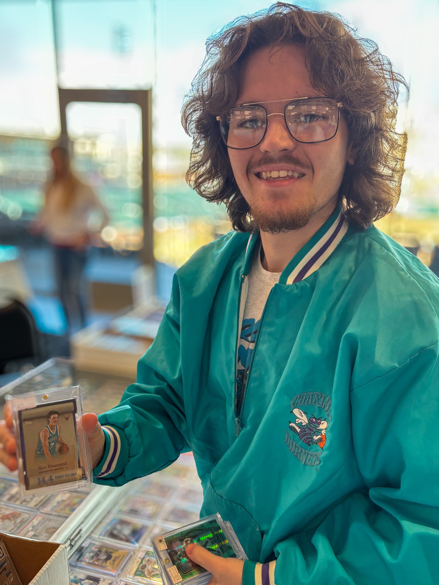 Collector and dealer Jalen Troublefield with a Kon Knueppel rookie card.