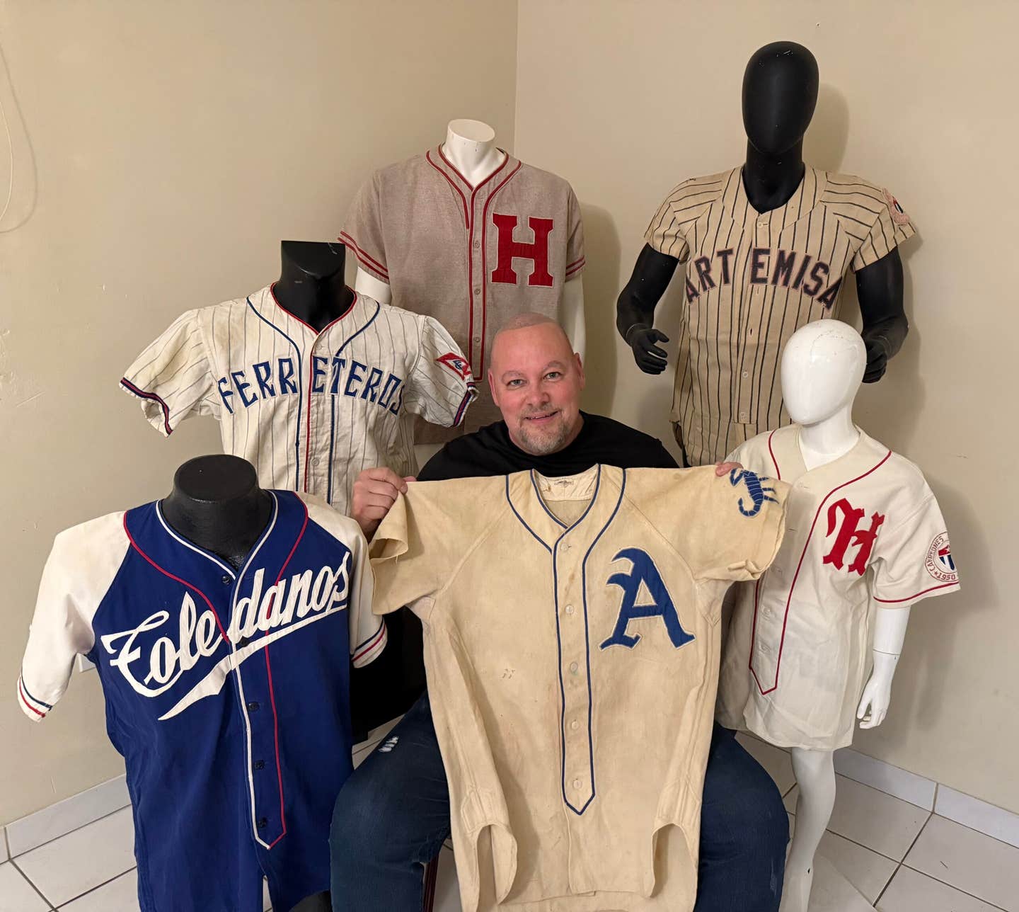 Longtime collector preserving Cuban baseball heritage with large collection of cards, memorabilia from his home country