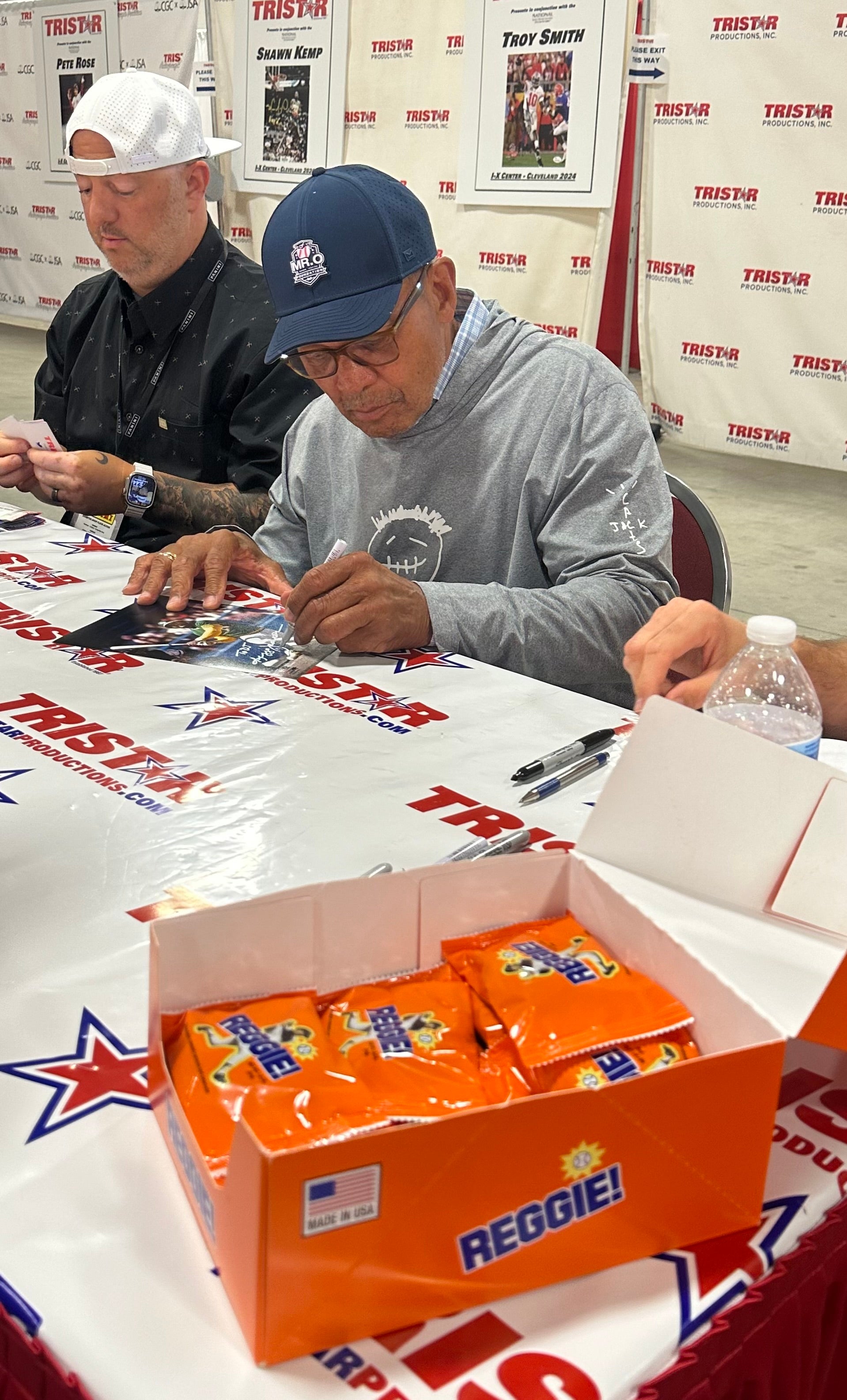 Reggie Jackson signs autographs at The National in 2024. 
